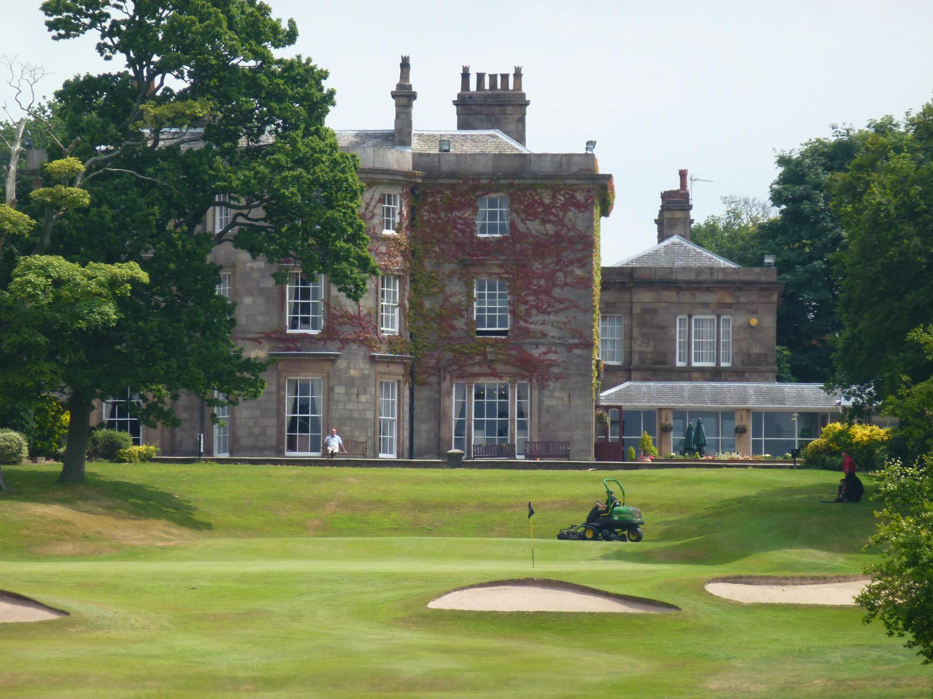 Panoramic view of the Shaw Hill Golf Resort & Spa Hotel building overlooking the course