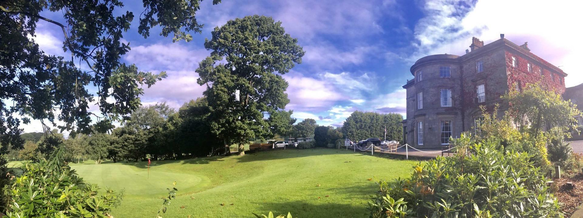 A well maintained fairway with the Shaw Hill Golf Resort & Spa Hotel overlooking the course