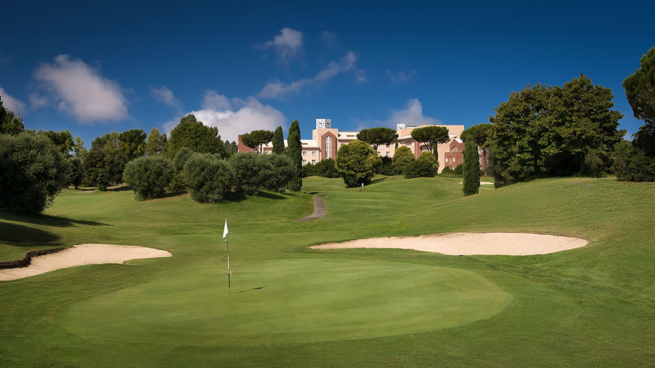 A smooth green surrounded by sand bunkers