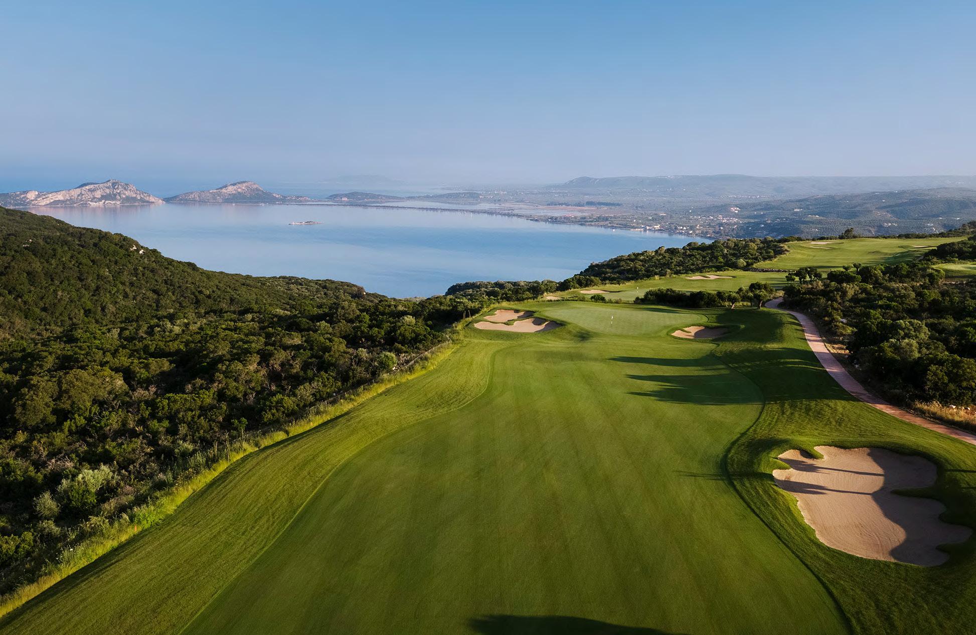 A well maintained fairway nestled with sand bunkers ad ocean views