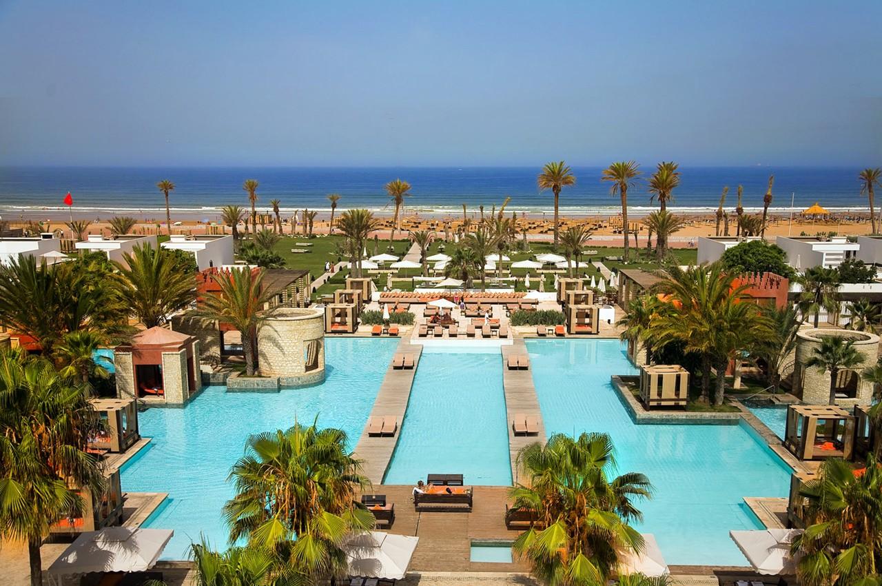 Overhead view of the outdoor swimming pool with coastal views