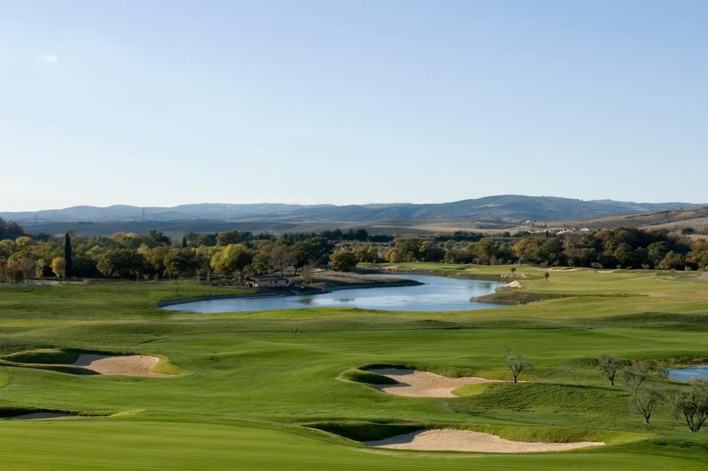 A well maintained fairway with sand bunkers