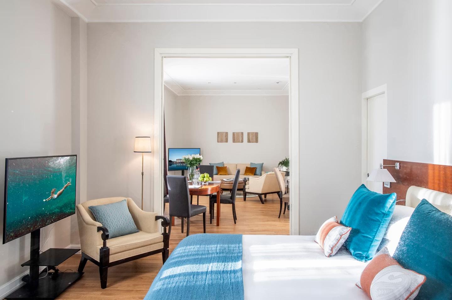 Double bed room leading to a living at the Terme Di Saturnia Natural Spa & Golf Resort
