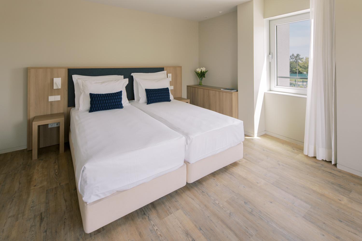 Twin bed room at The Editory by the Sea Troia Comporta Hotel