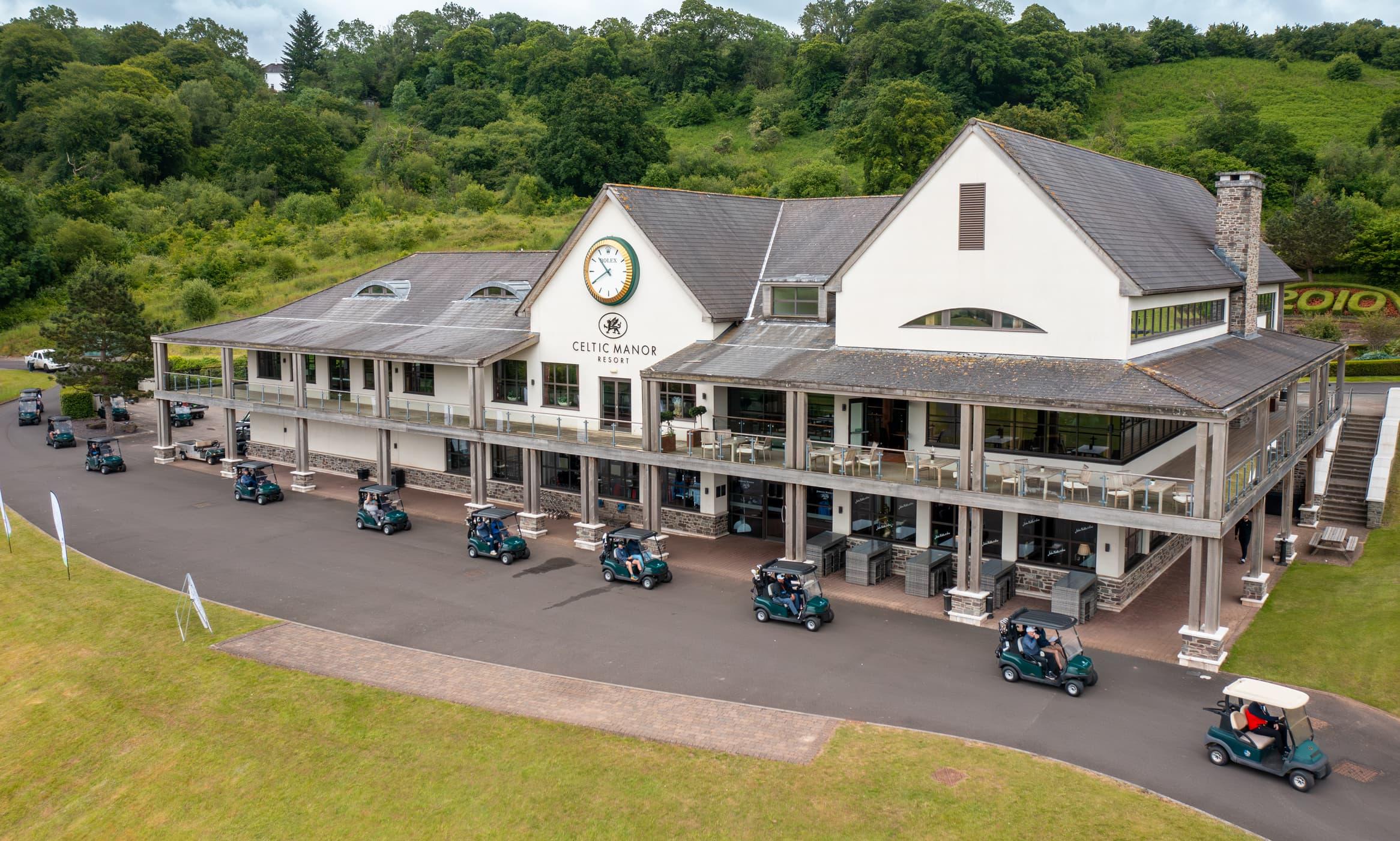 Buggies parked outside the clubhouse at The Manor House at Celtic Manor