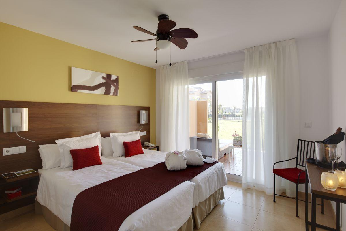 Double bed room with balcony access at The Residences at Mar Menor