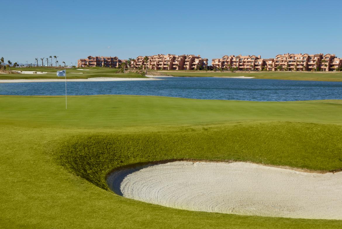 A well maintained fairway with a sand bunker at The Residences at Mar Menor