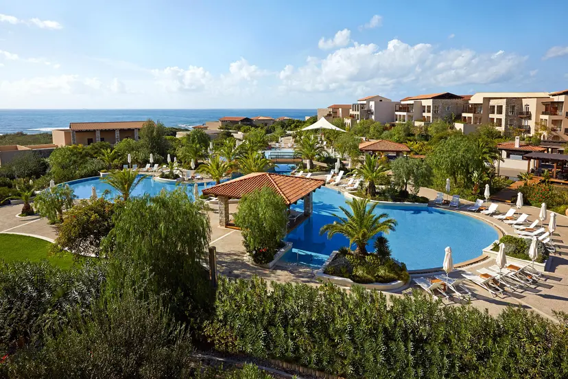 Overhead view of the outdoor swimming pool at The Westin Resort Costa Navarino with a water slide