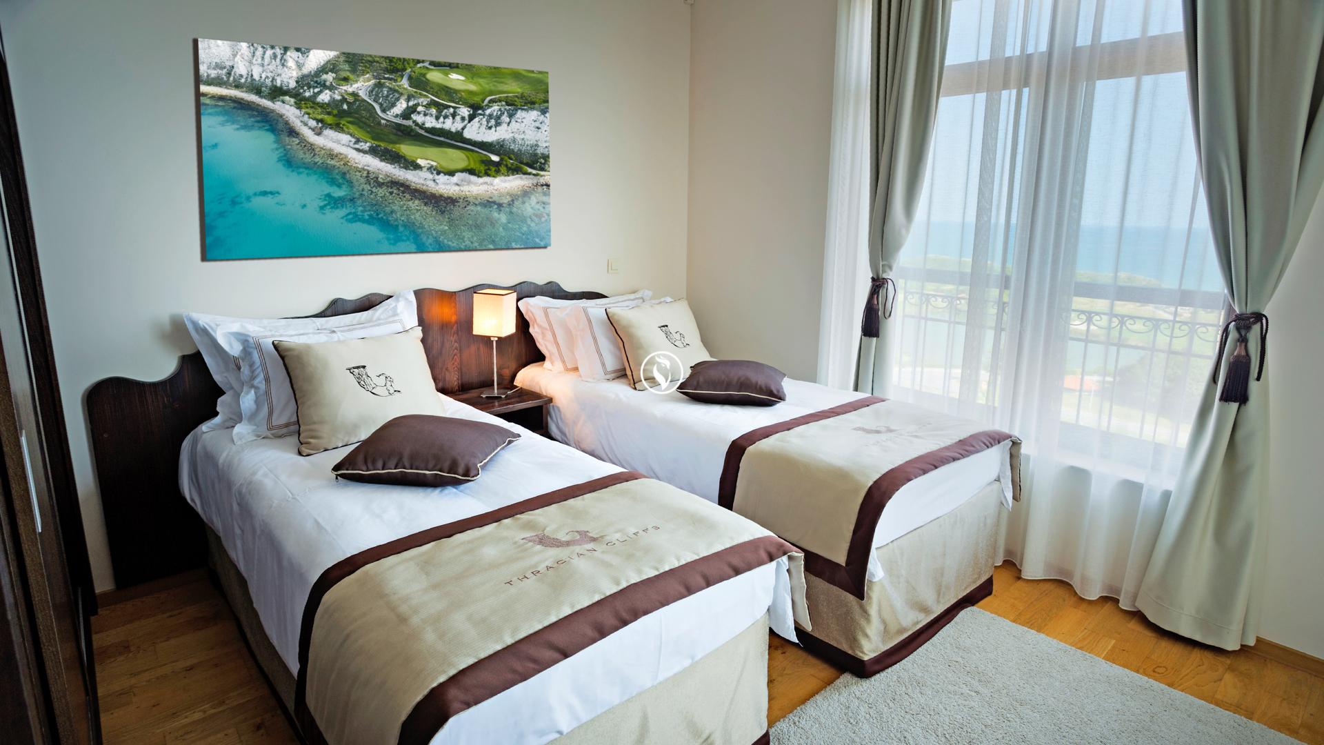 Twin bed room the Thracian Cliffs Golf & Beach Resort