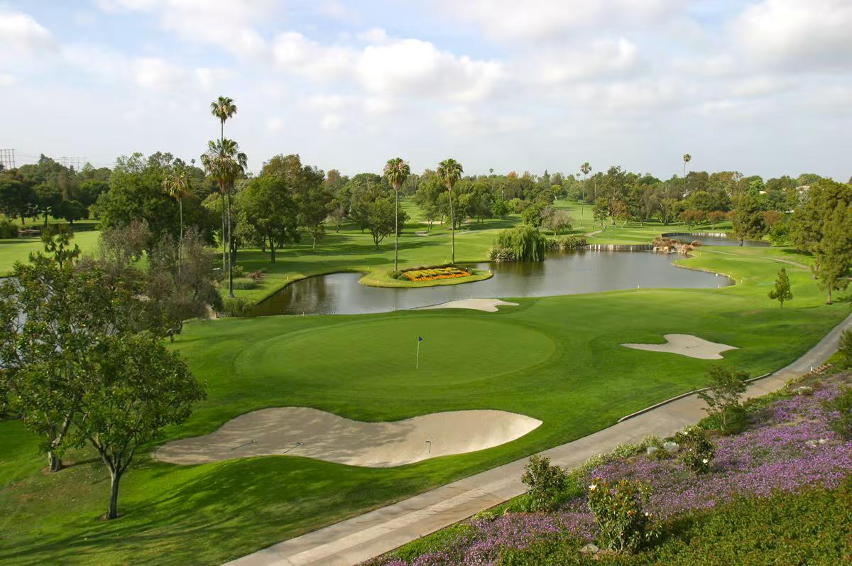 A well maintained fairway nestled with sand bunkers at the Tivoli Alvor Algarve Resort