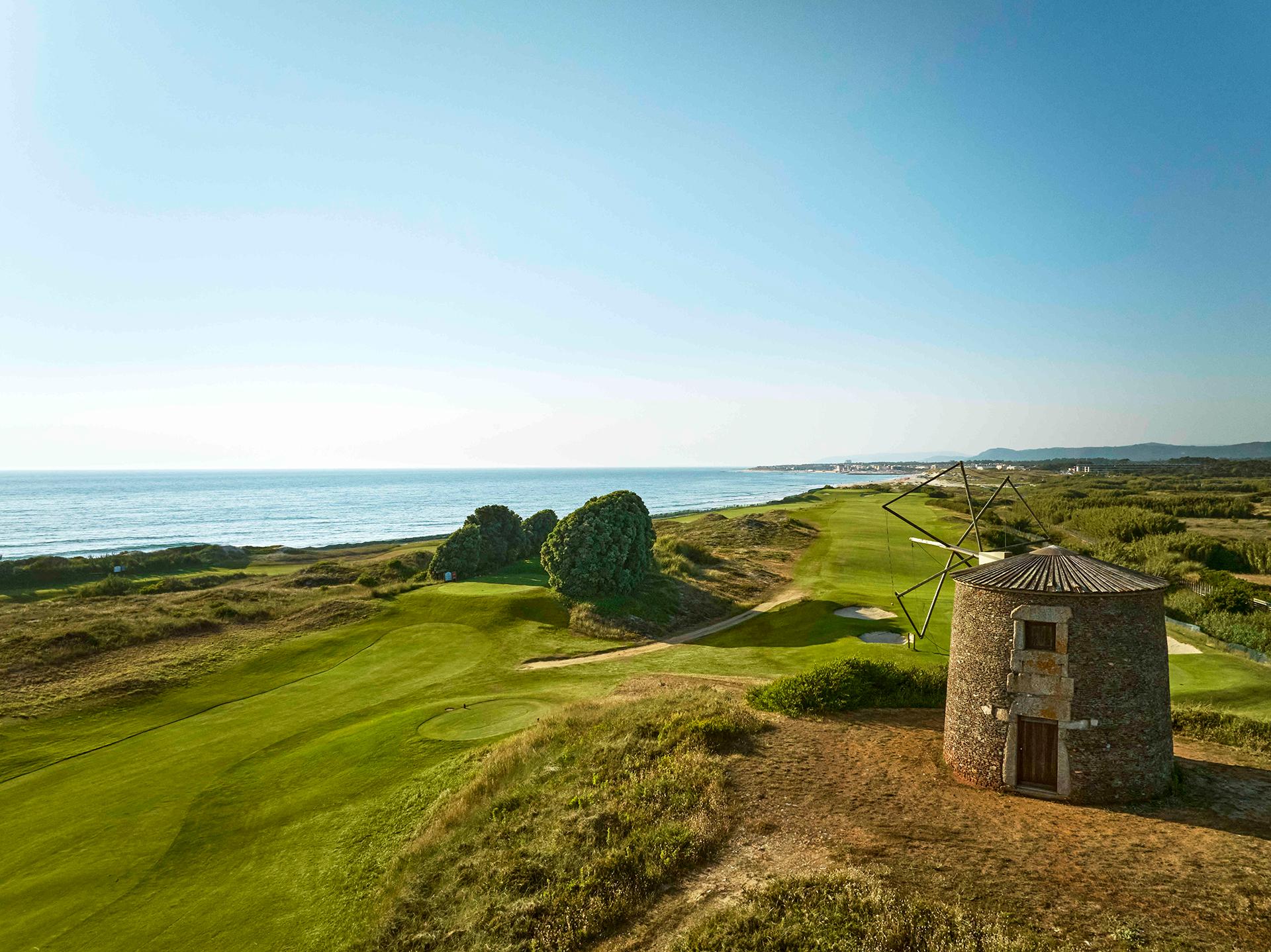 A well maintained coastal fairway under clear blue skies