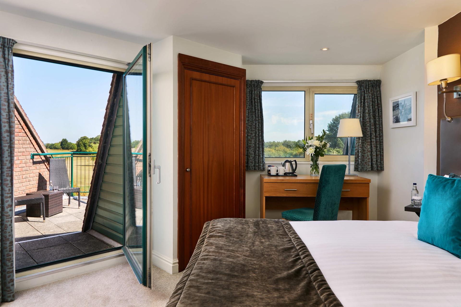 Double bed suite with balcony views of the course