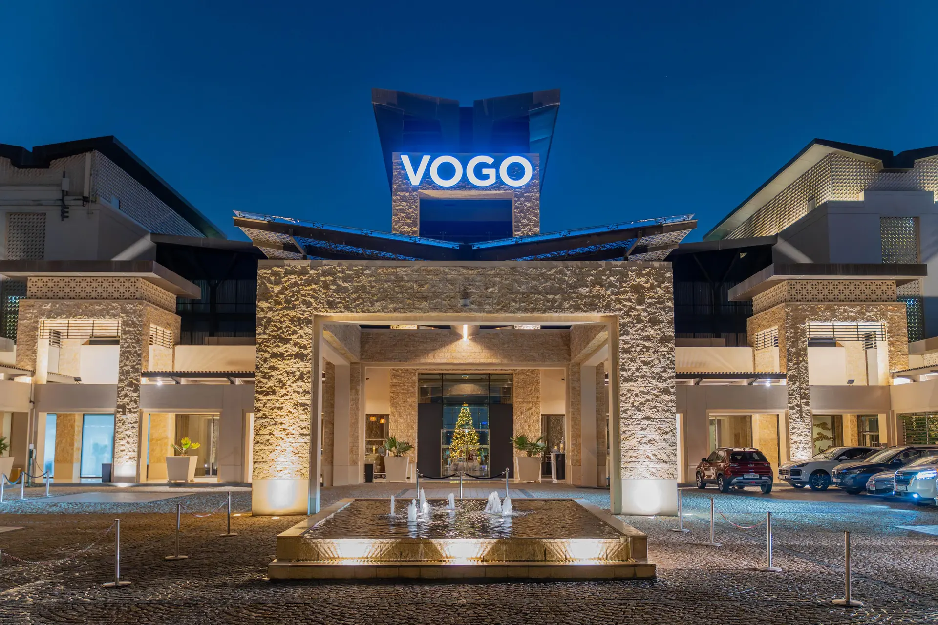 Front entrance to the VOGO Abu Dhabi Golf Resort & Spa lit up at night