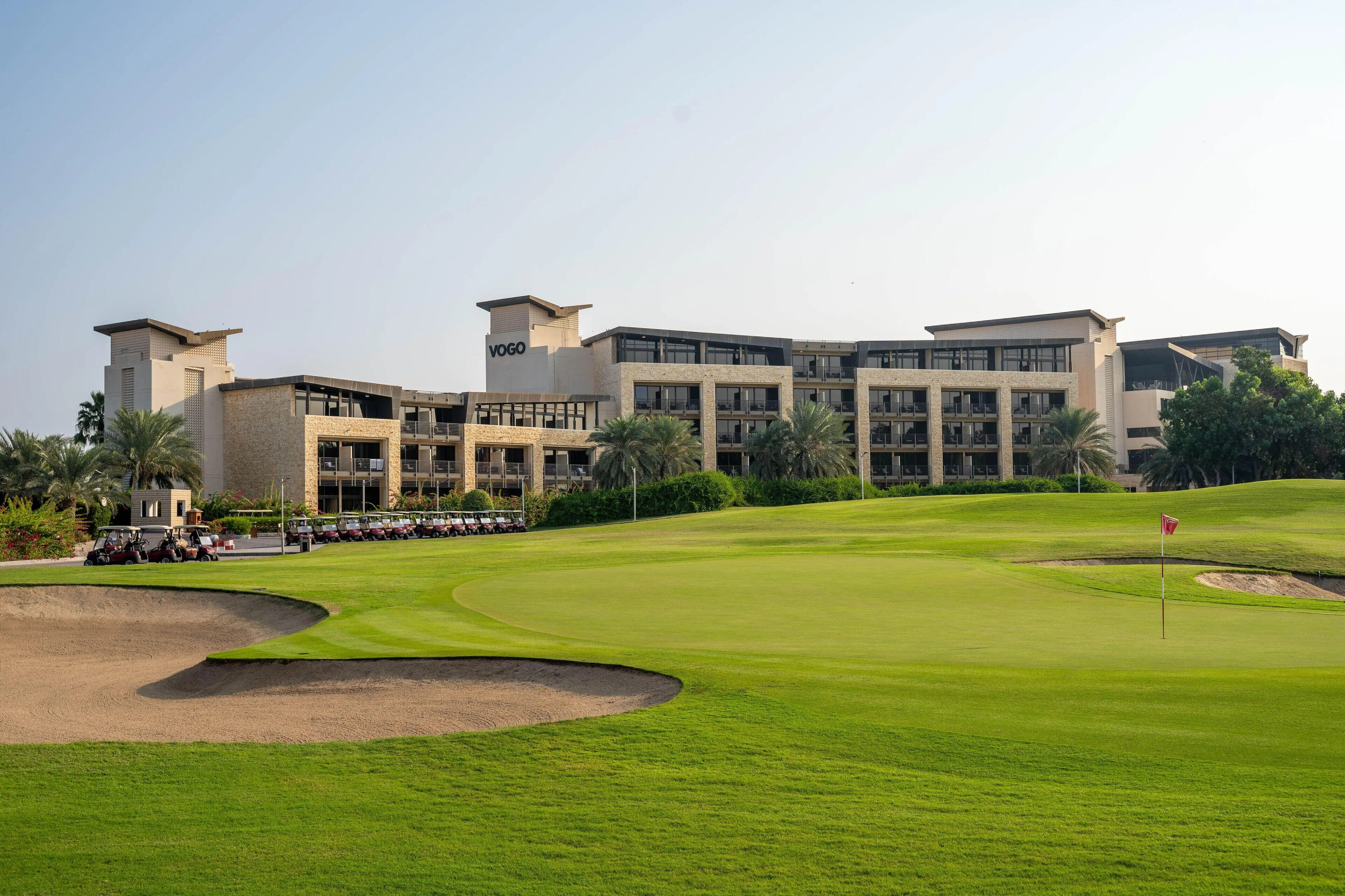The VOGO Abu Dhabi Golf Resort & Spa clubhouse overlooking the course