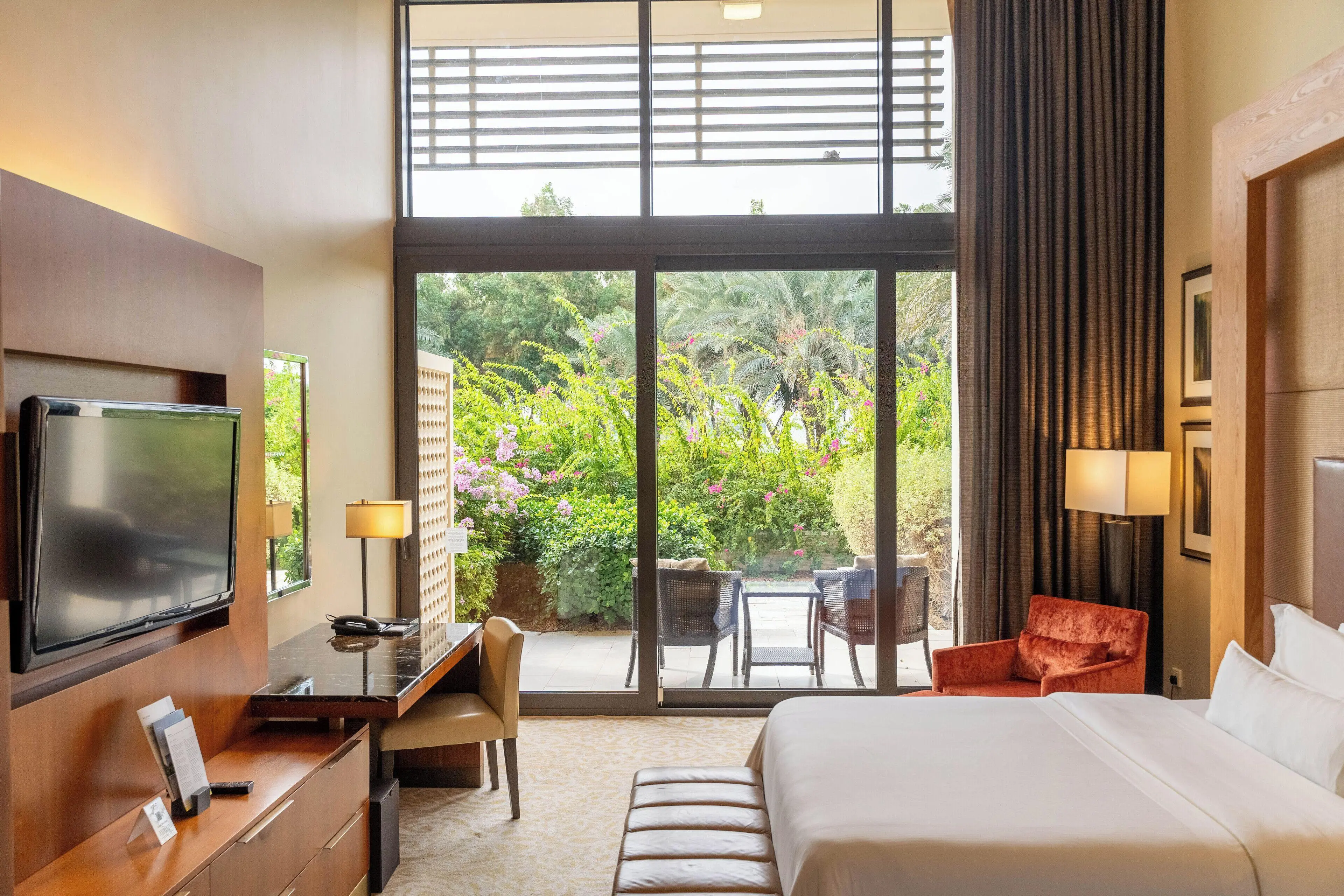 Double bed suite with a patio space at VOGO Abu Dhabi Golf Resort & Spa