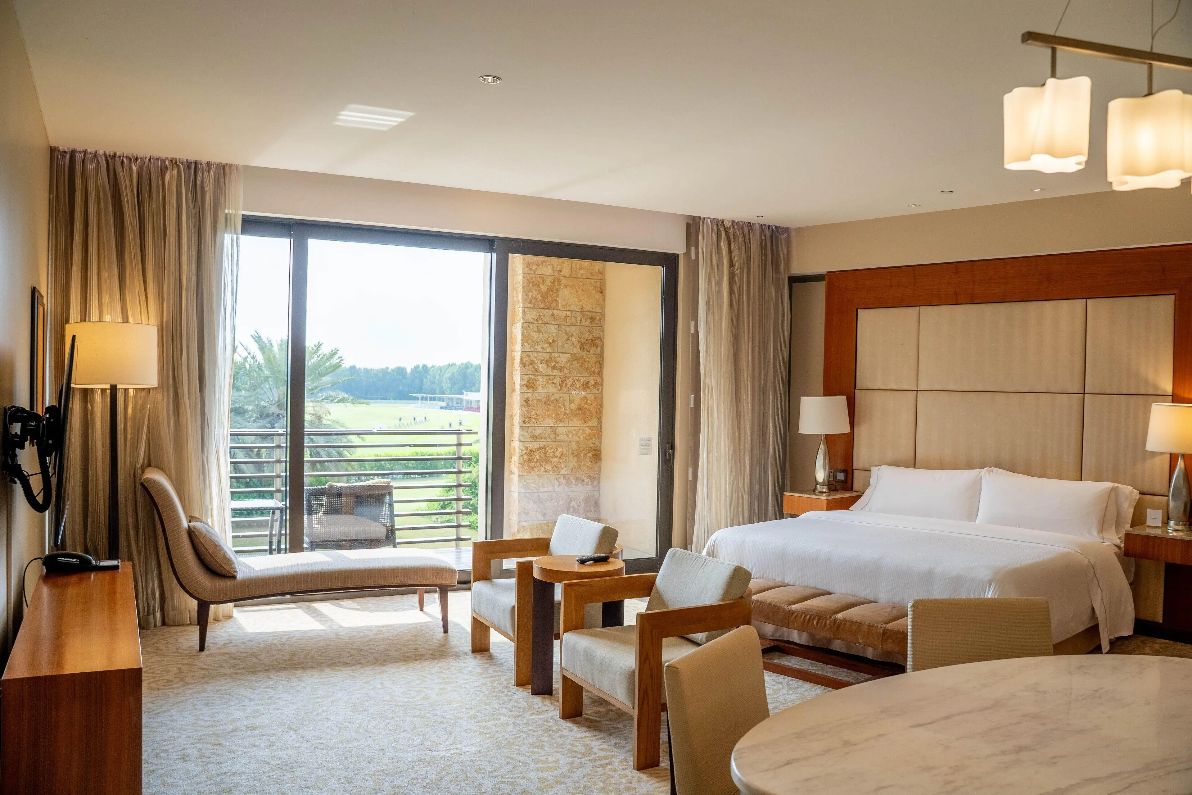 Double bed suite with balcony views at VOGO Abu Dhabi Golf Resort & Spa