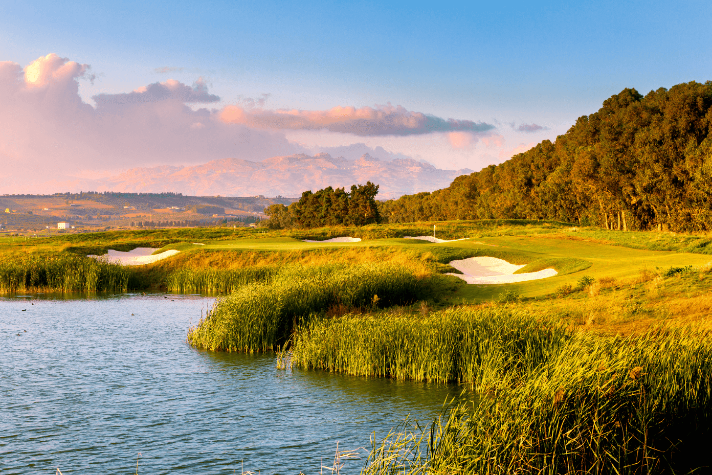 A well maintained fairway with sand bunkers