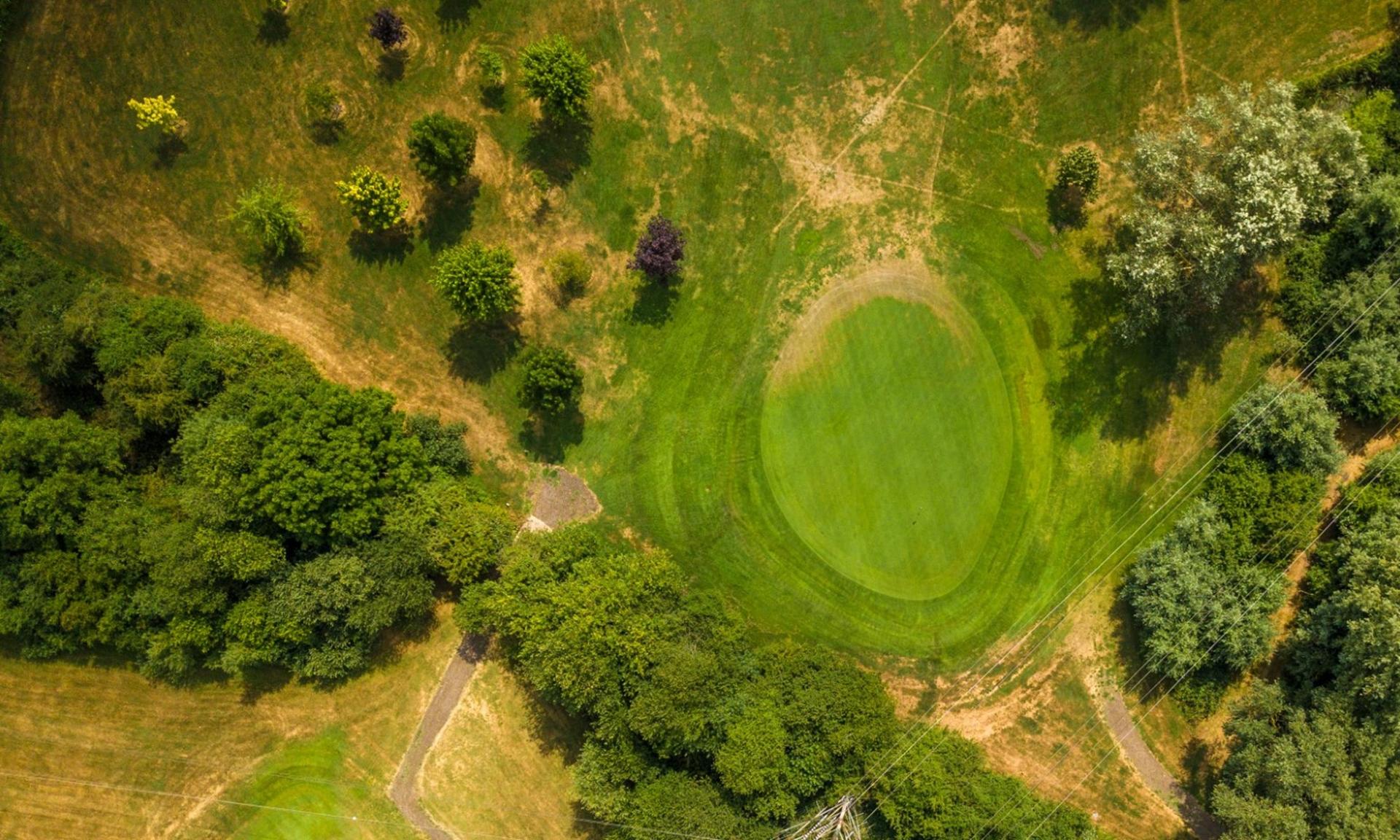 Overhead view of a fairway leading to a smooth green