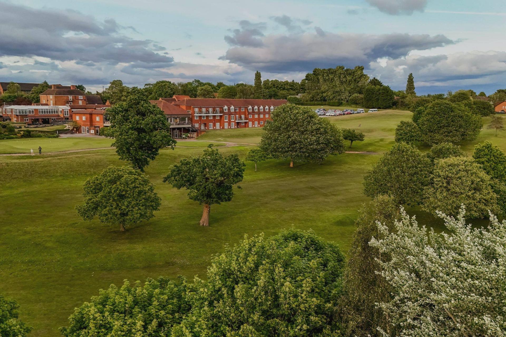 Overhead view of the Windmill Village Hotel, Golf Club & Spa building overlooking the course