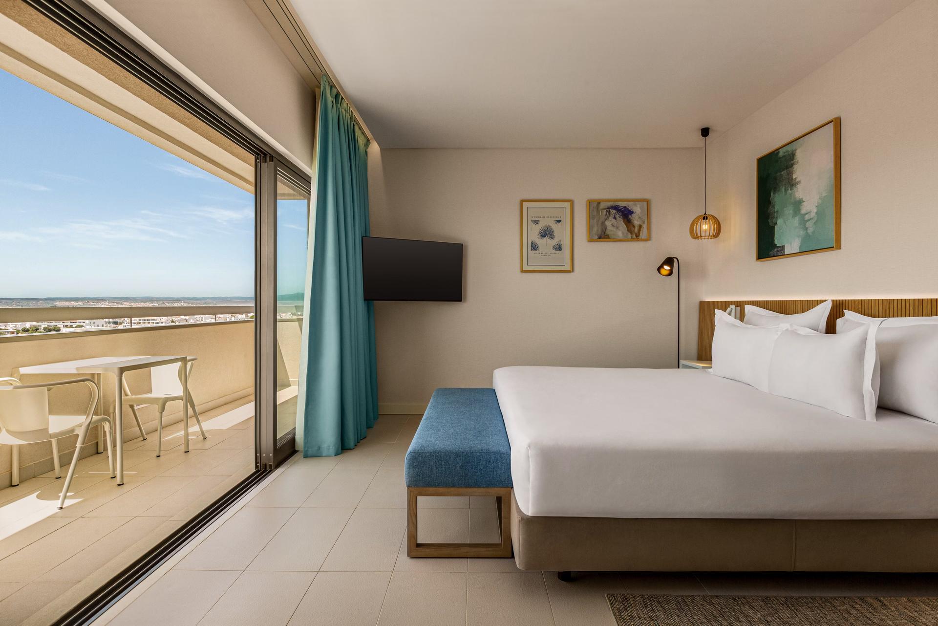 Double bed room with balcony views at the Wyndham Residences Alvor Beach