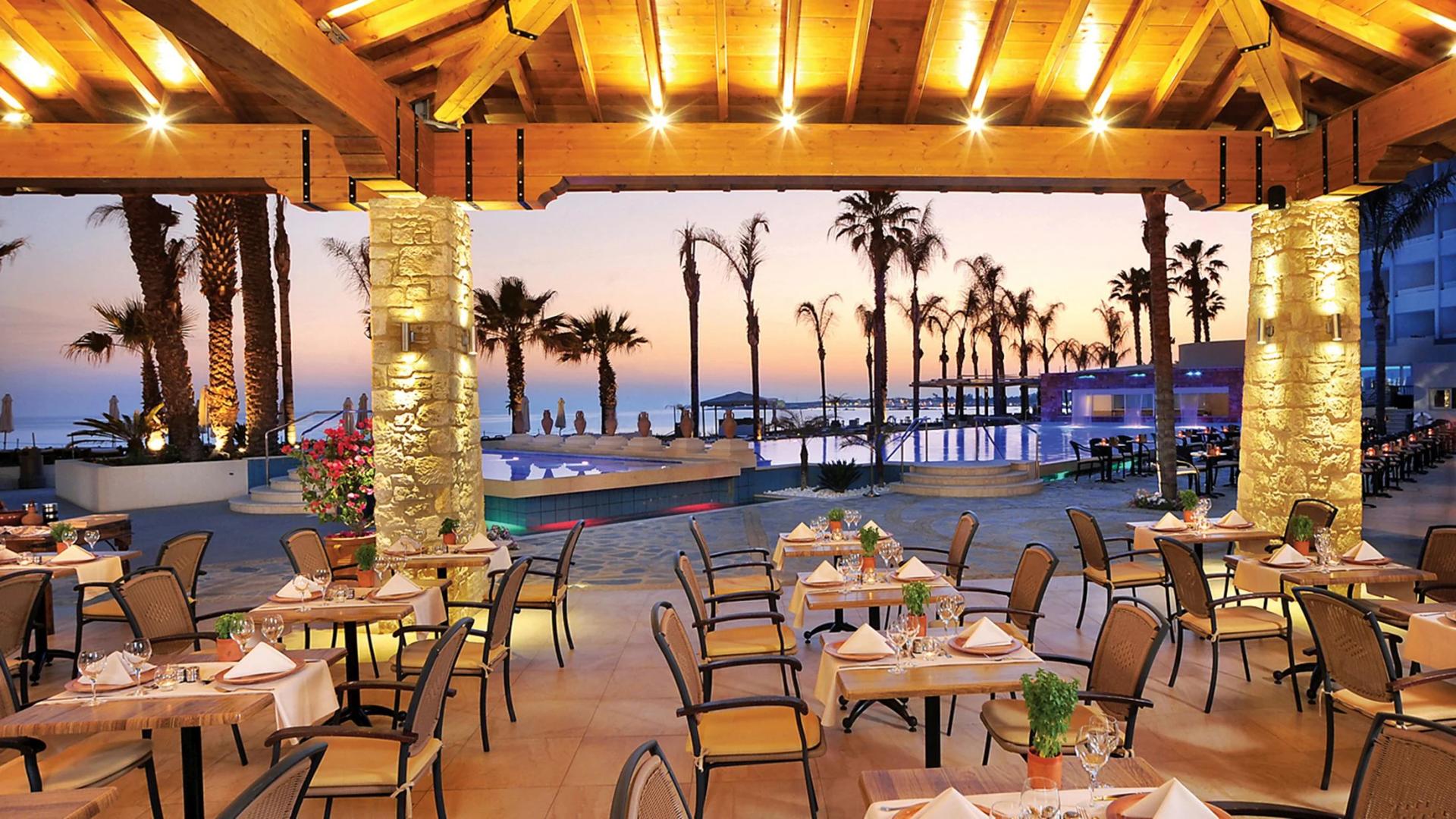 Outdoor dining area at Alexander The Great Beach Hotel