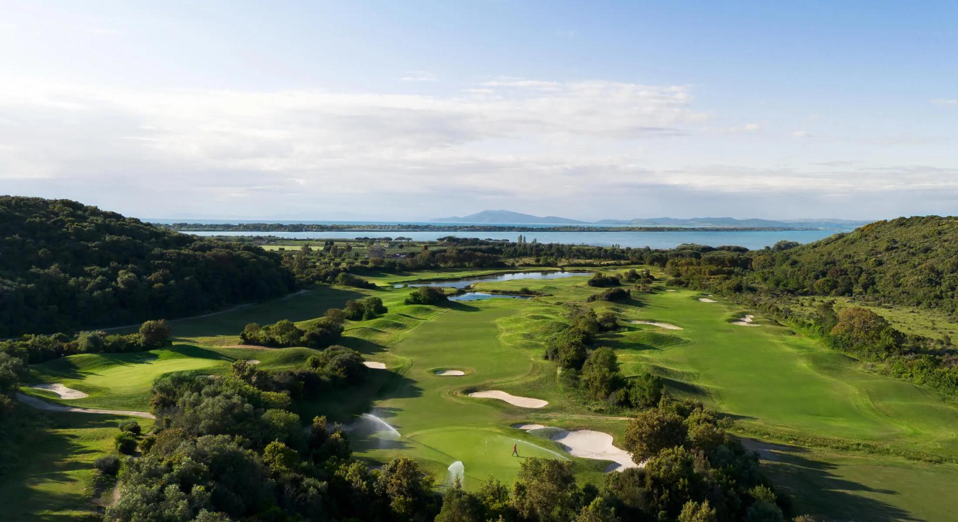 Overhead view of a well maintained fairway nestled with sand bunkers