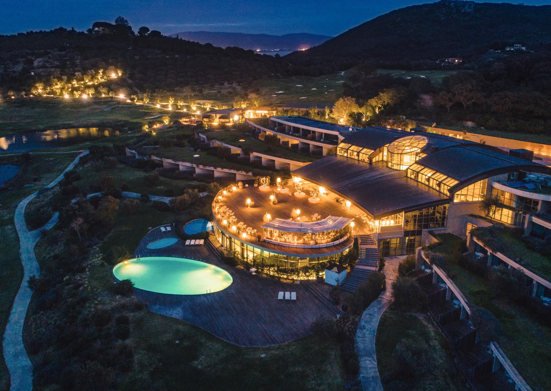 Overhead view of Argentario Resort Golf and Spa lit up at night