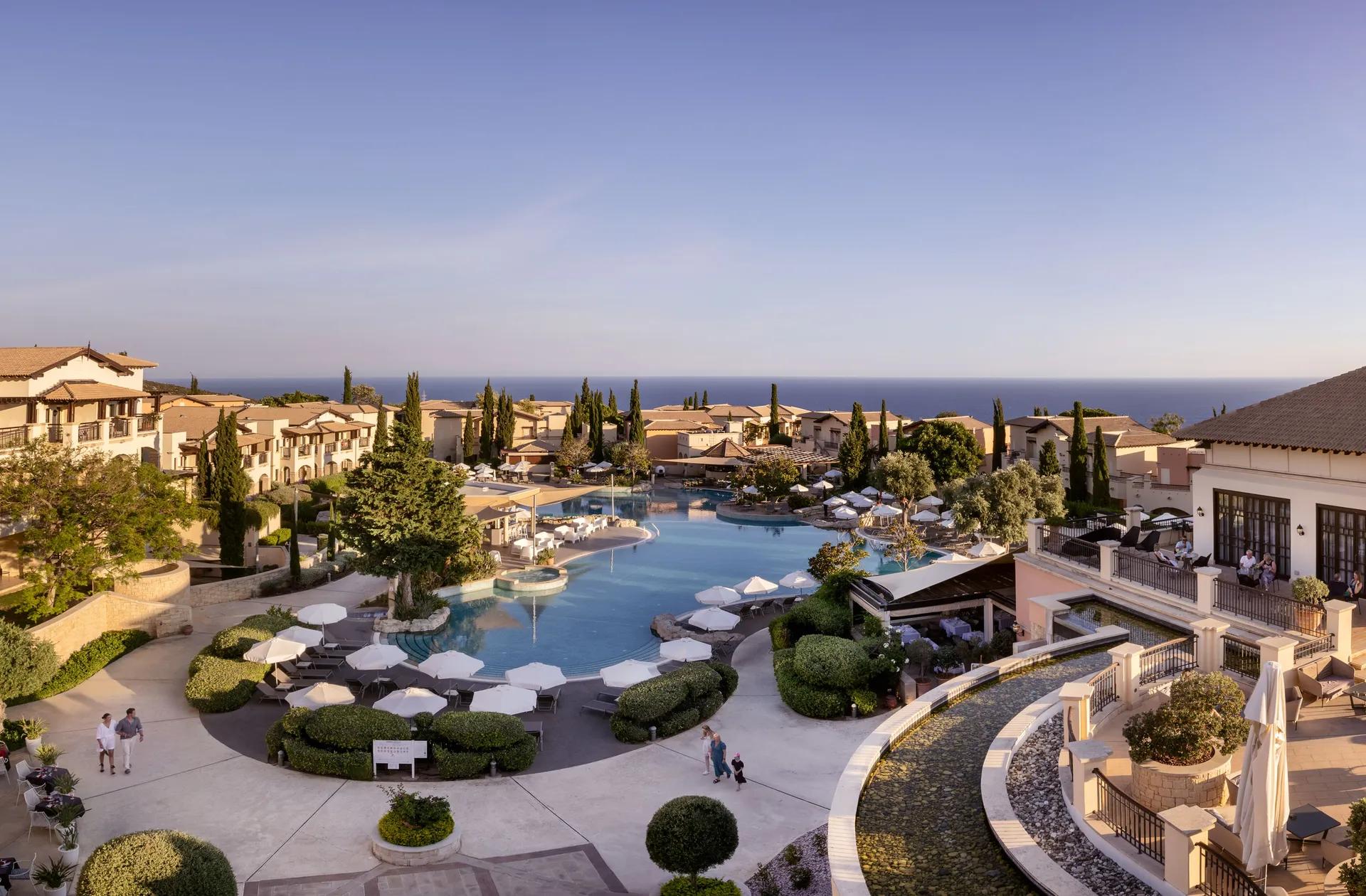 Overhead view of outdoor swimming pool at Atlantica Aphrodite Hills Hotel