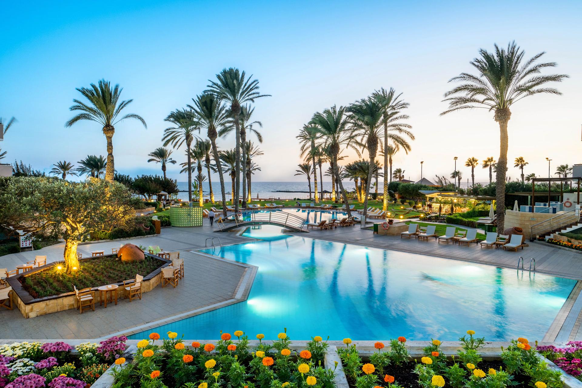 Panoramic view of an outdoor swimming pool at Constantinou Bros Asimina Suites Hotel