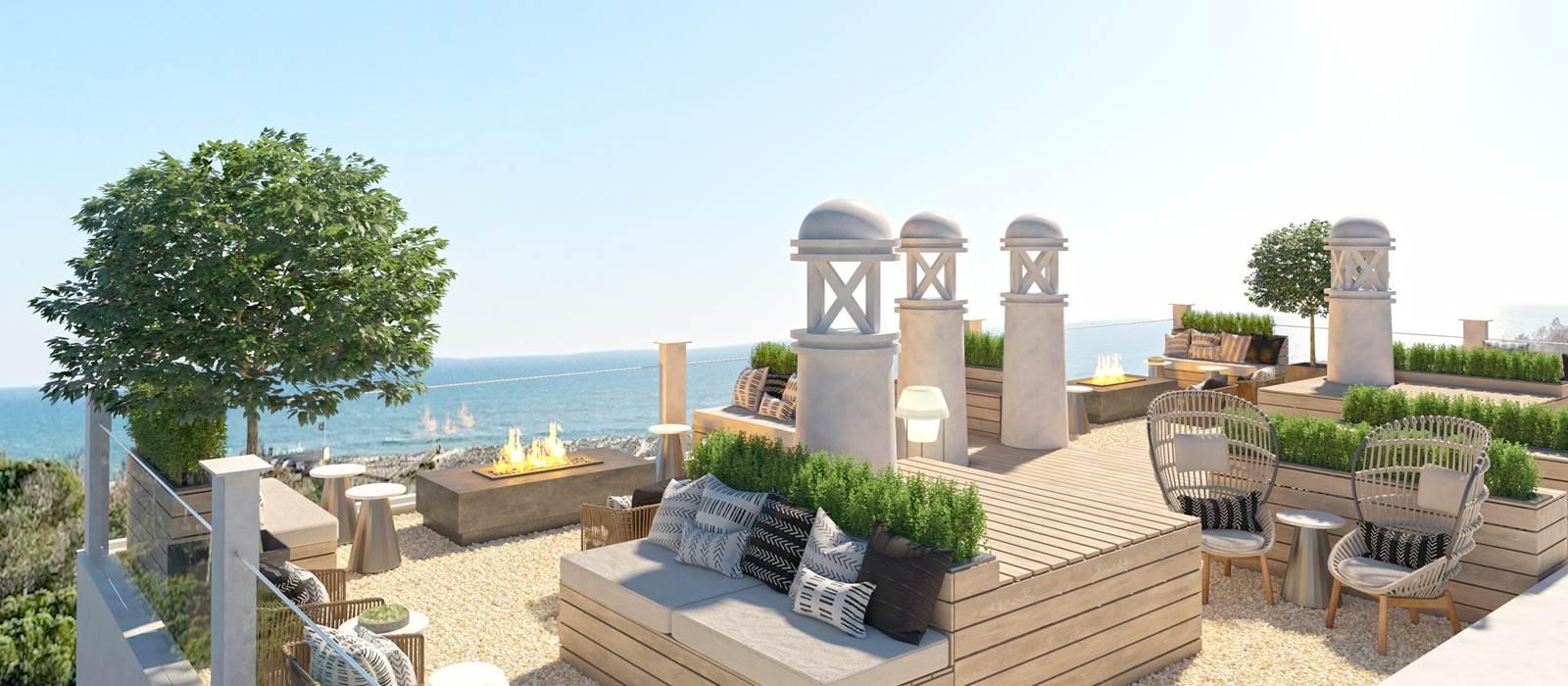 Outdoor lounging area with views of the coast at Formosa Park Apartment Hotel