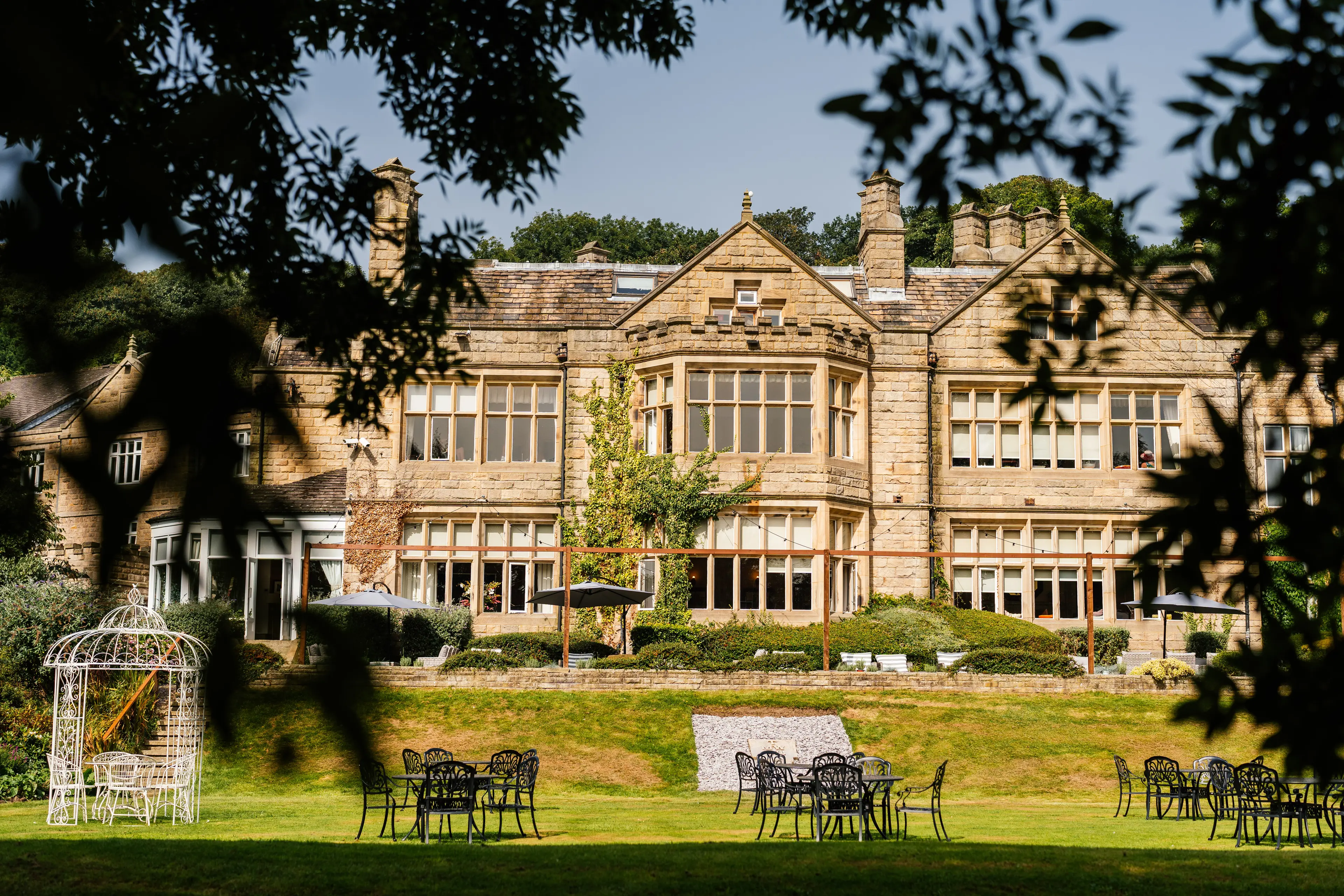 Panoramic view of Hollins Hall Hotel & Country Club through the trees