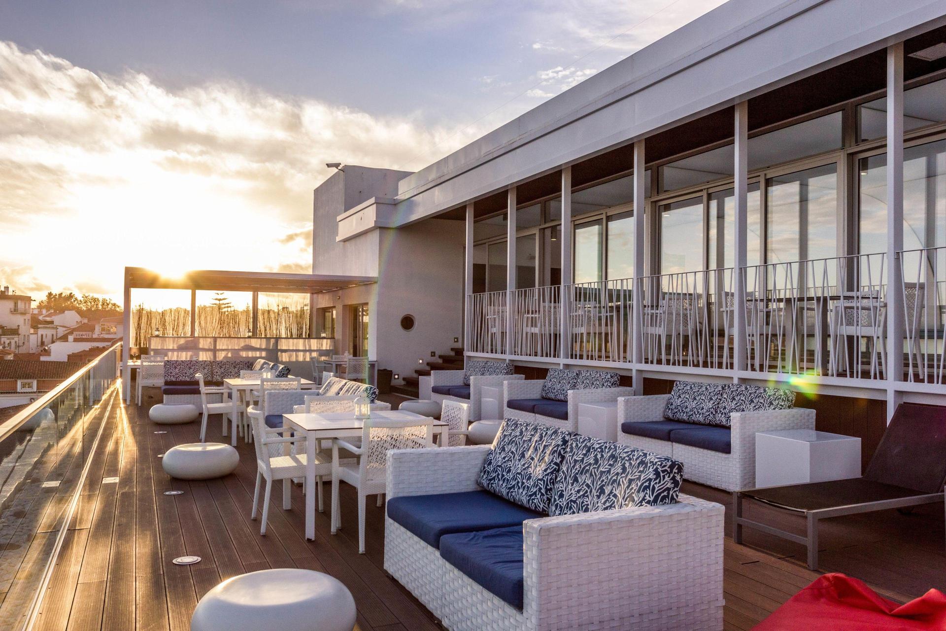 Rooftop bar and lounging area at Hotel Baia