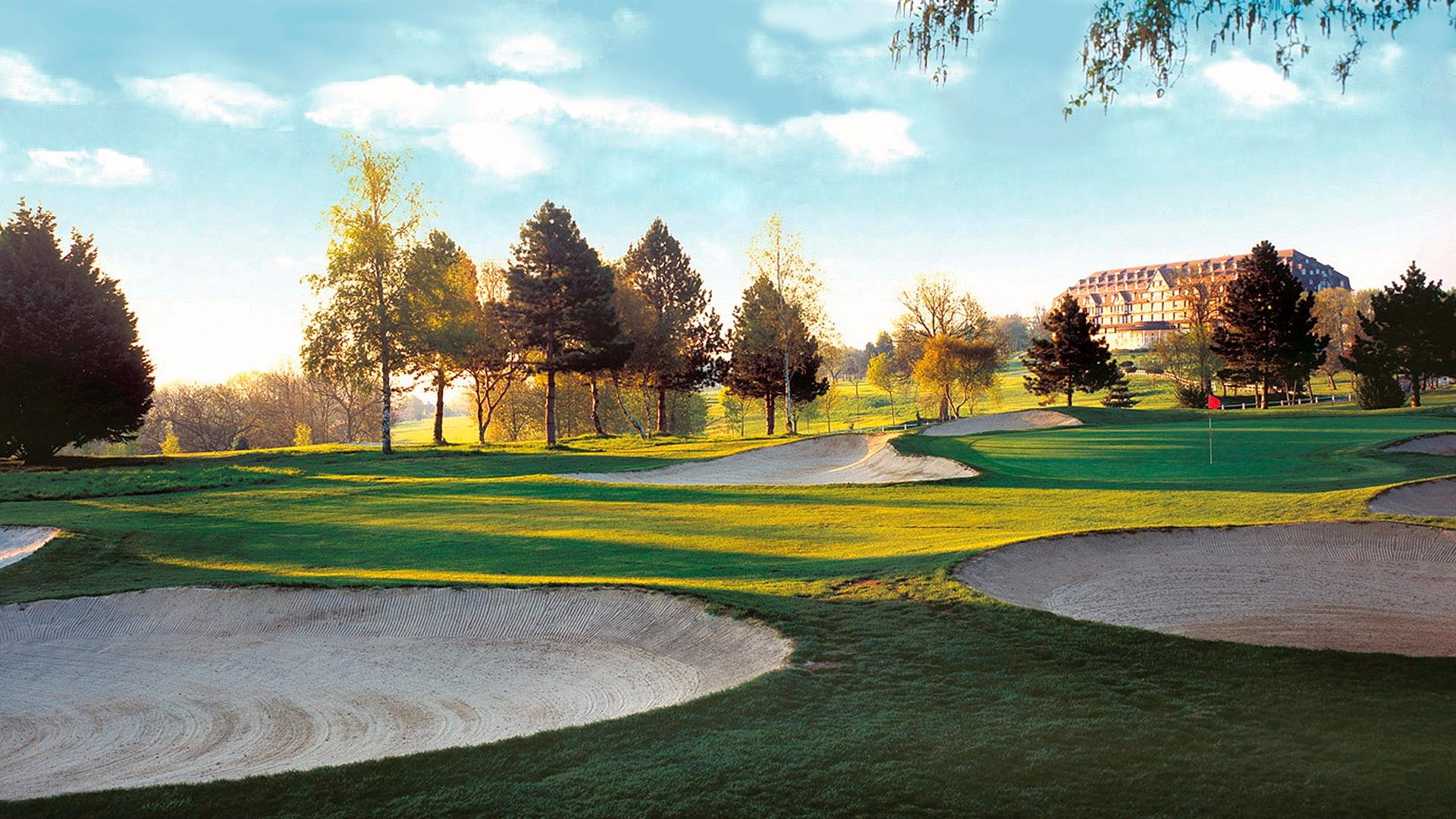 A well maintained fairway nestled with deep sand bunkers