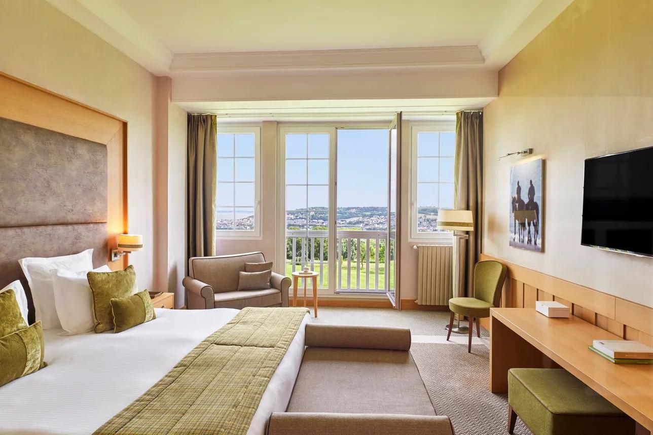 Double bed suite with views of the course at Hotel Barriere L'Hotel du Golf