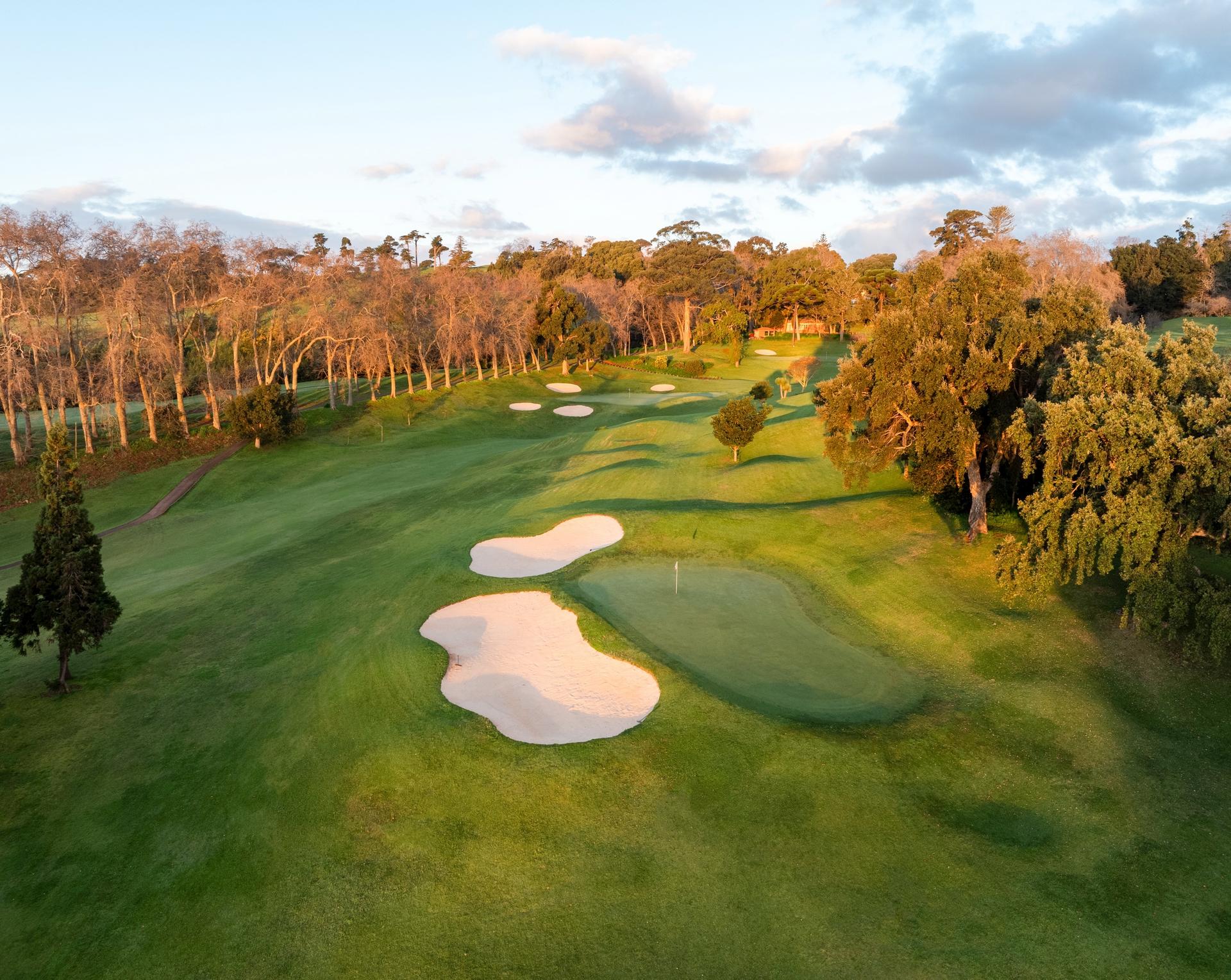A well maintained fairway nestled with sand bunkers at Hotel Casa Velha do Palheiro - Relais & Chateaux