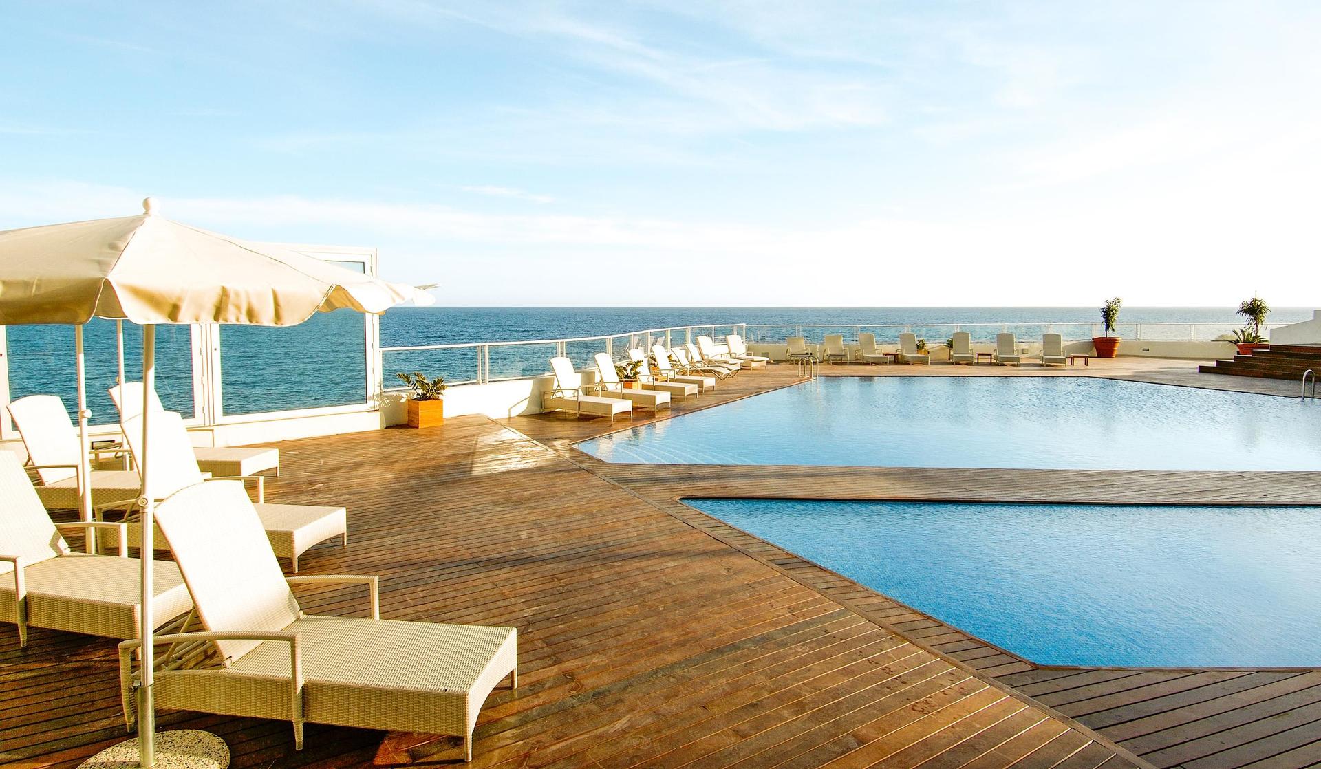 Panoramic view of the outdoor swimming pool at Hotel Tenerife Golf & Sea View