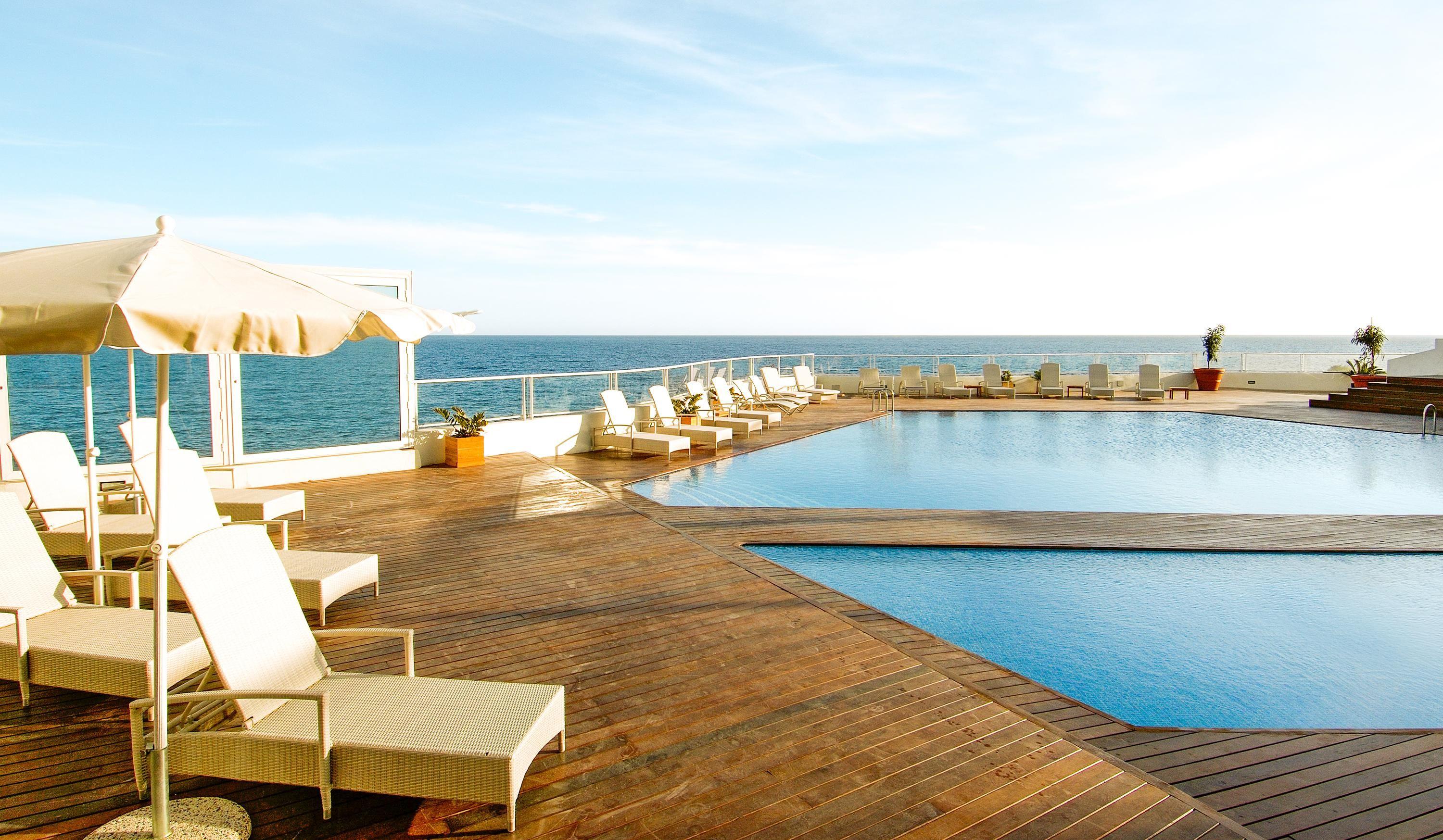 Panoramic view of the outdoor swimming pool at Hotel Tenerife Golf & Sea View