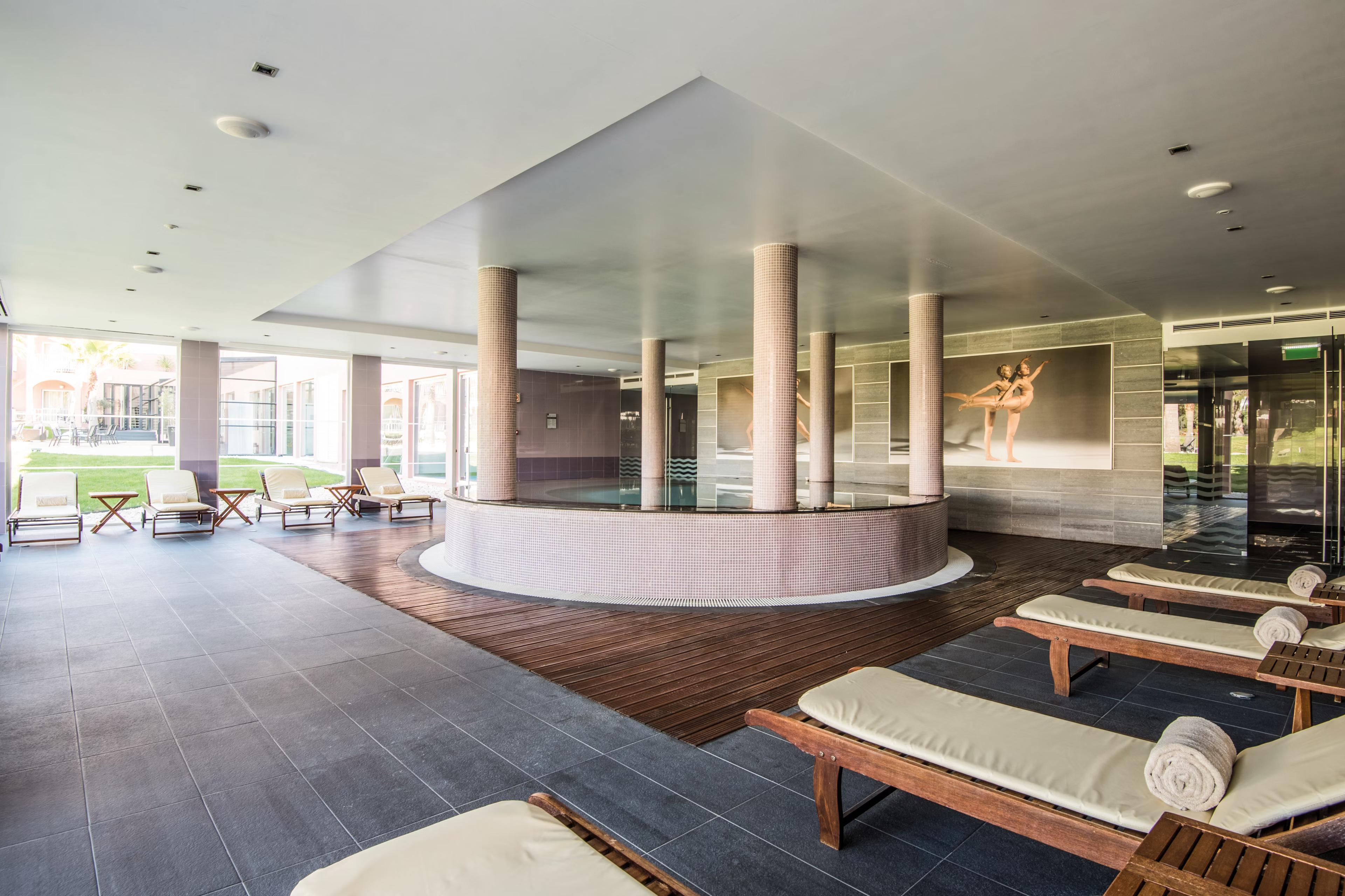 Indoor pool part of spa facilities at Hotel Vila Gale Collection Praia