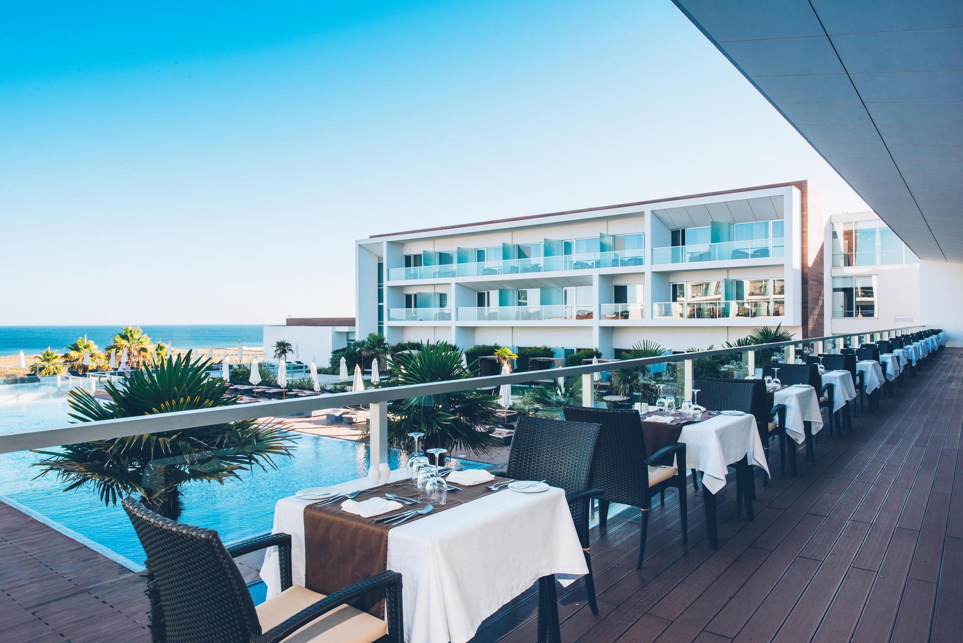 Balcony dining with pool views at Iberostar Selection Lagos Algarve
