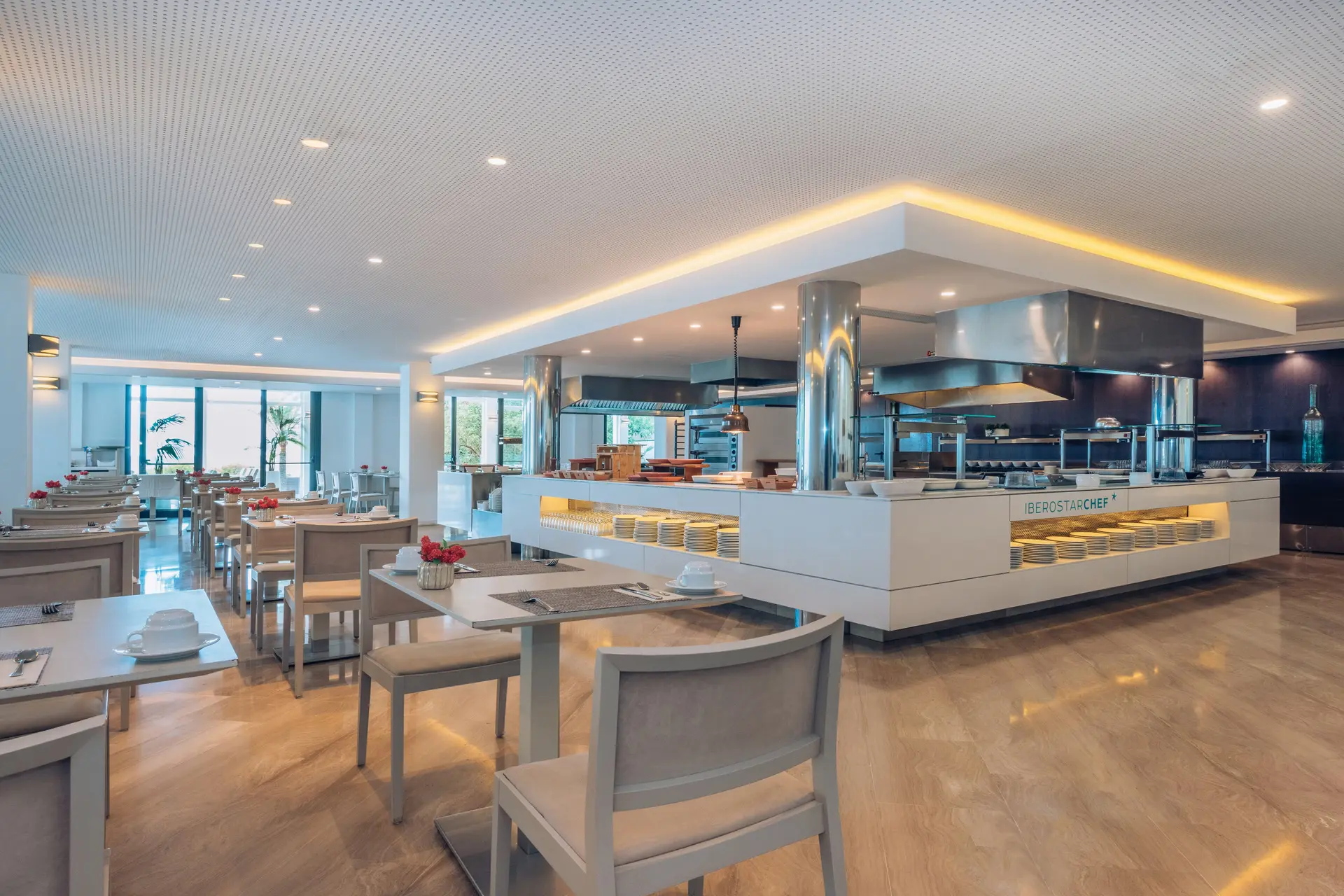 Indoor dining with a food bar at Iberostar Waves Cala Millor