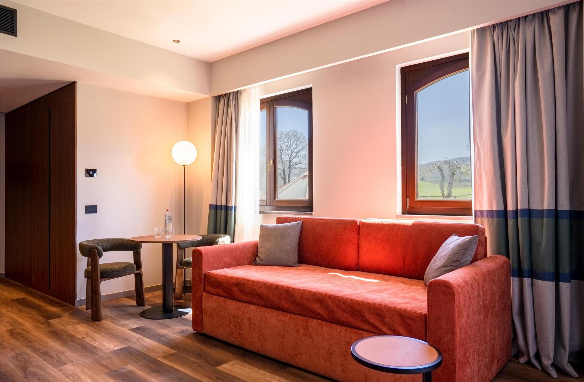 Sofa as part of a suite at Il Picciolo Etna Golf Resort & Spa, Curio Collection by Hilton