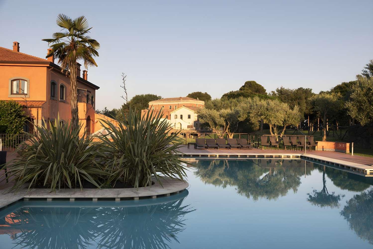 Outdoor swimming pool at Il Picciolo Etna Golf Resort & Spa, Curio Collection by Hilton