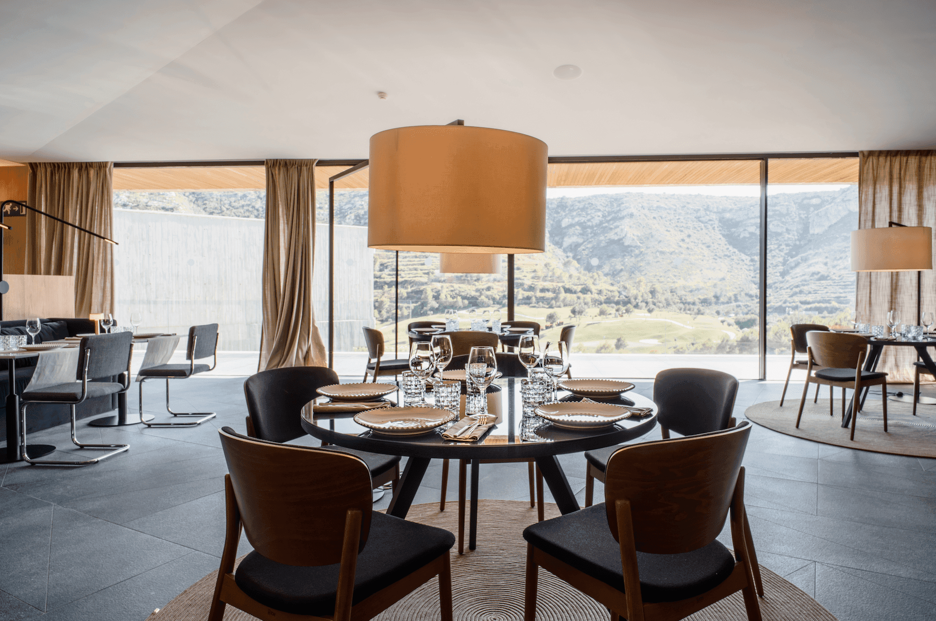 Indoor dining room at La Galiana Golf Resort with views of the course