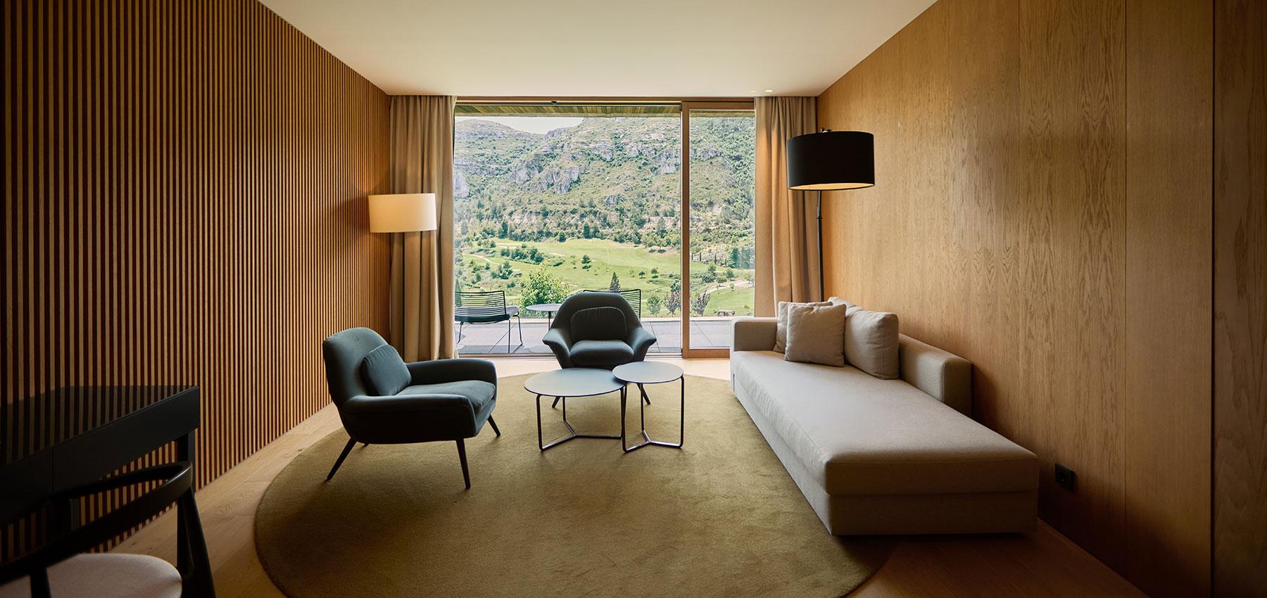 Living room as part of a suite with views of the course