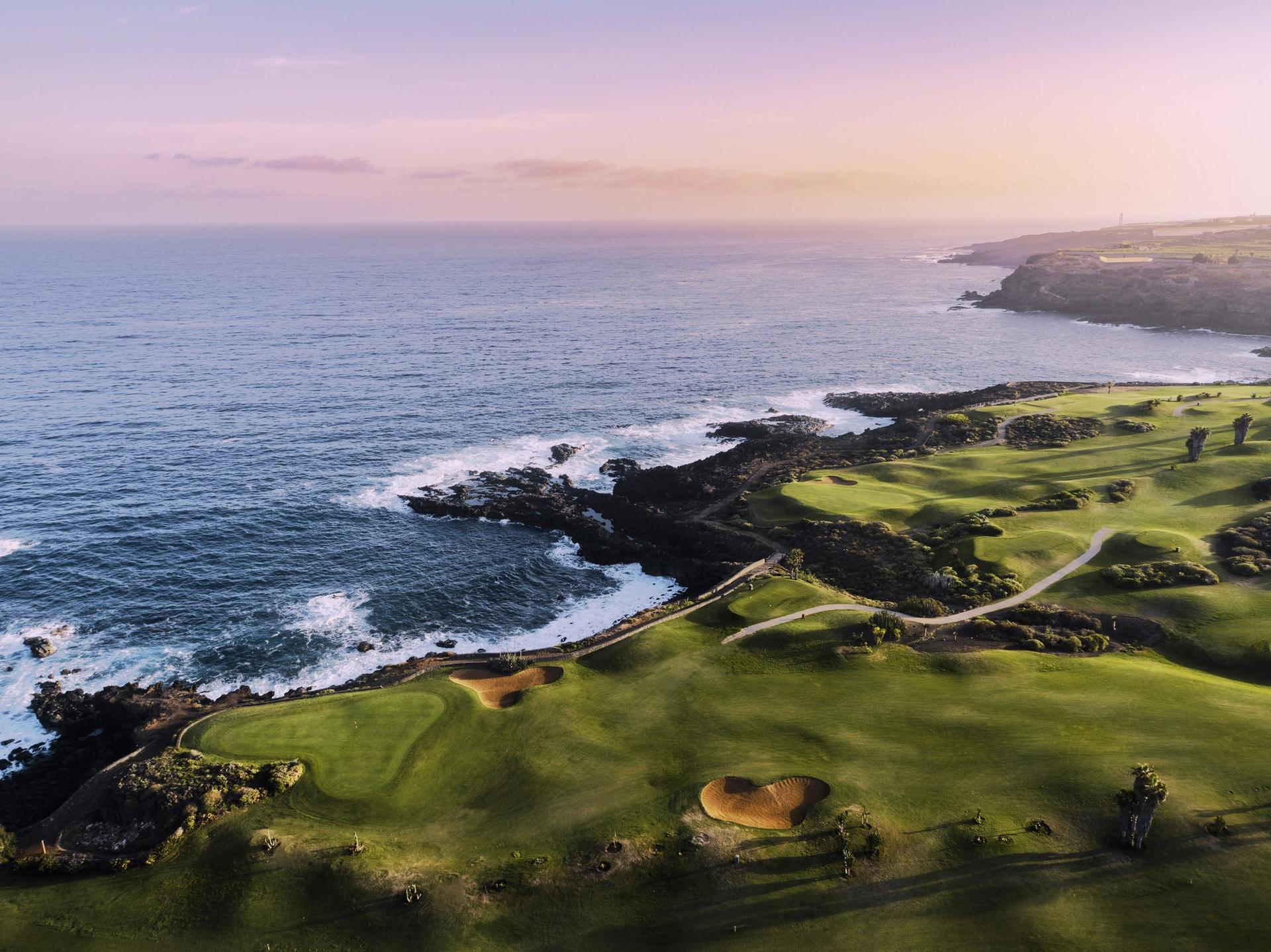 Overhead view of a coastal fairway nestled witth sand bunkers
