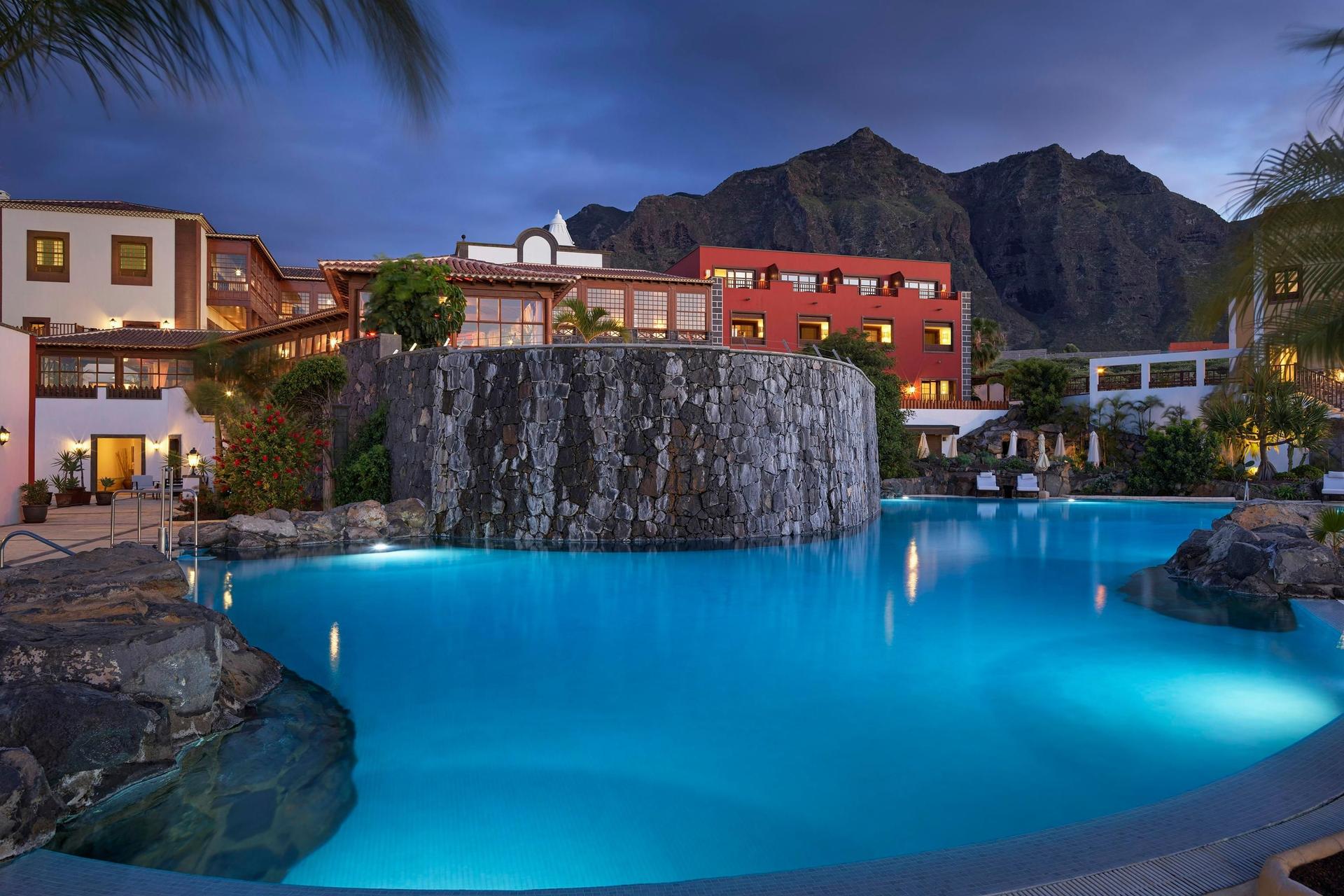 Outdoor swimming pool in the evening at Melia Hacienda Del Conde