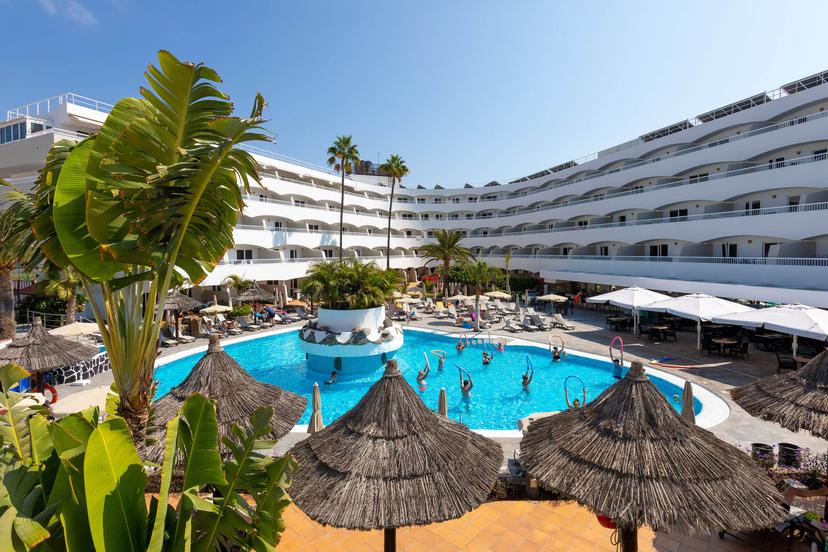 Panoramic view of the Melia Sol Barbacan building overlooking the outdoor pool