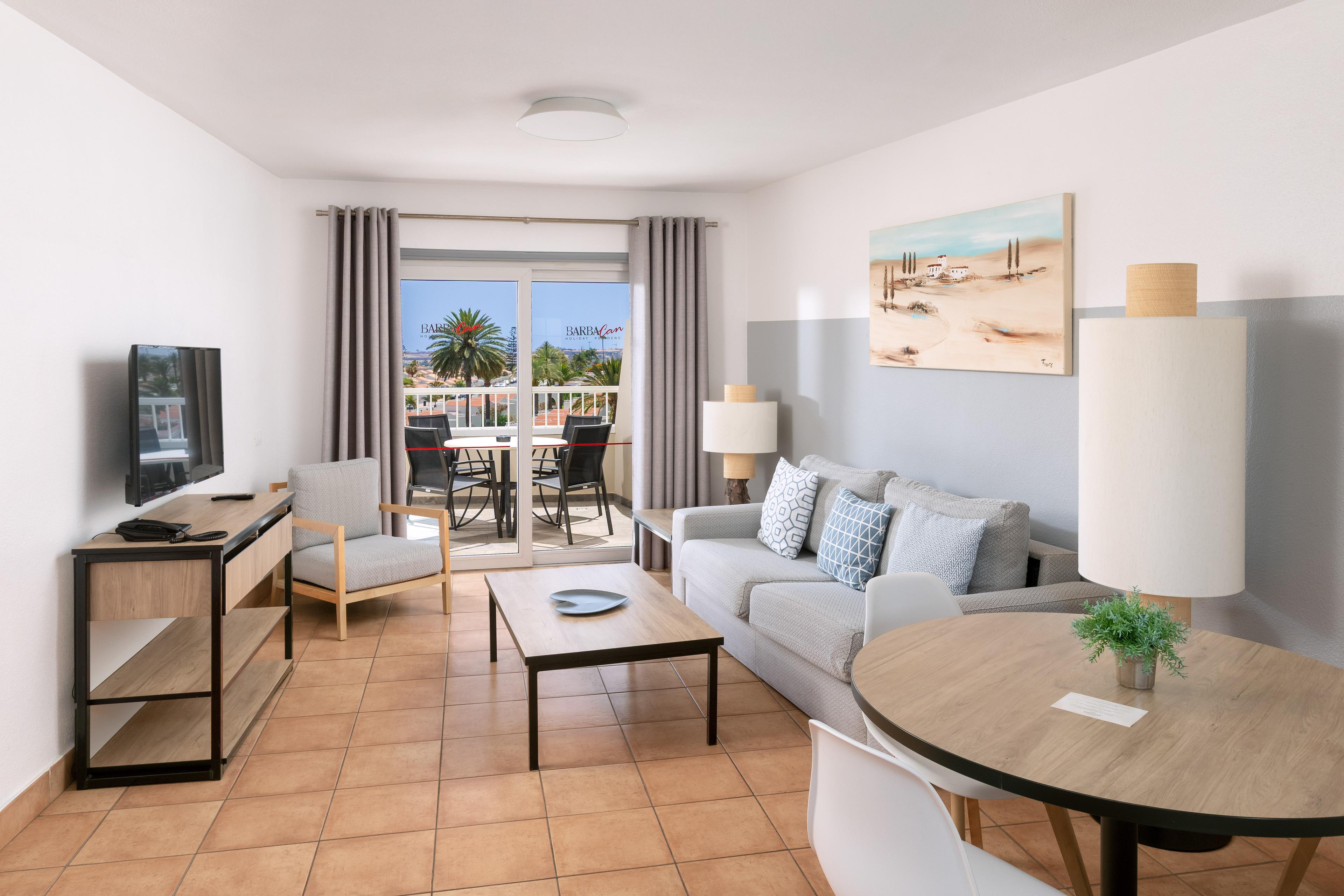 Living room as part of a suite at Melia Sol Barbacan