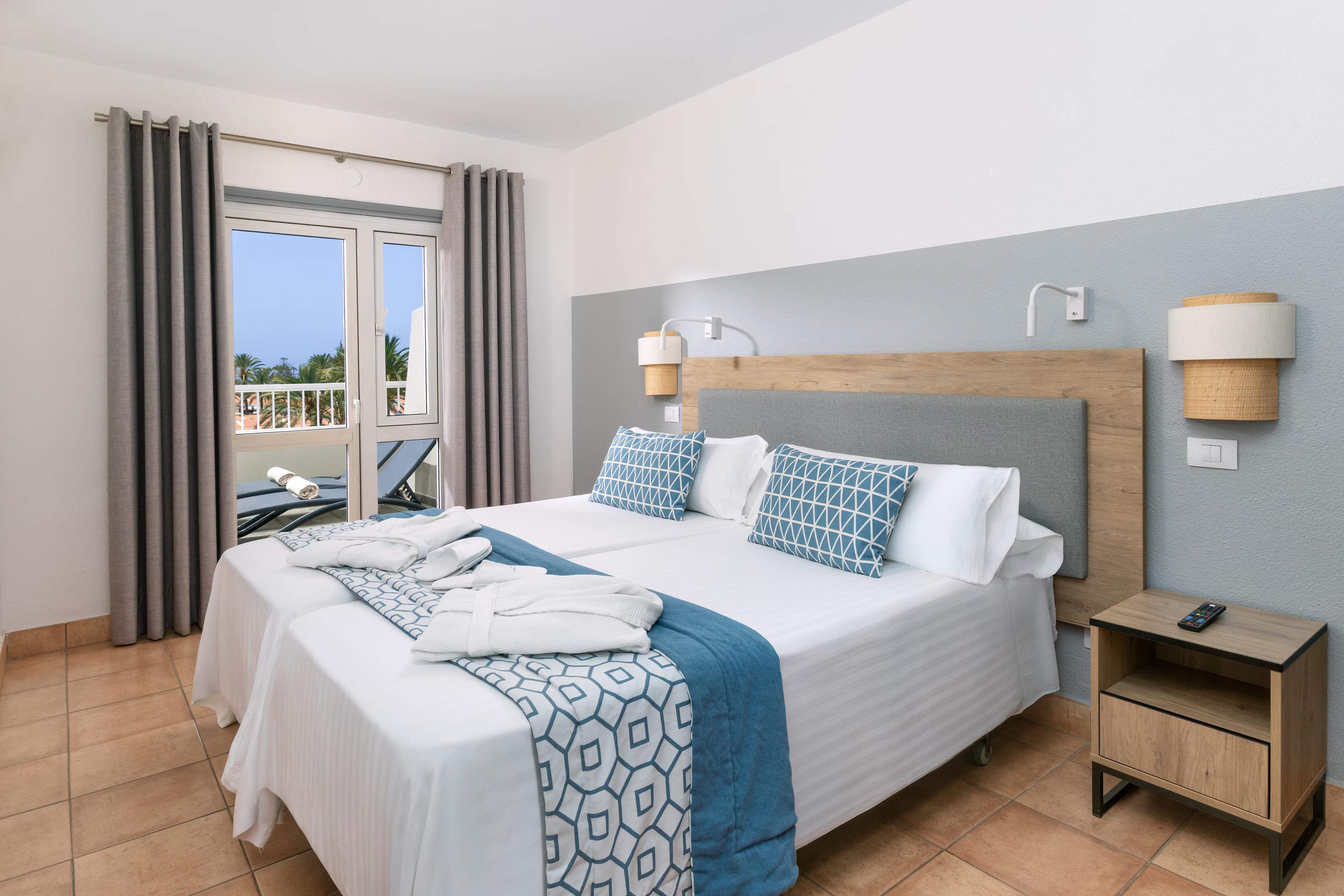 Double bed suite with balcony views at Melia Sol Barbacan