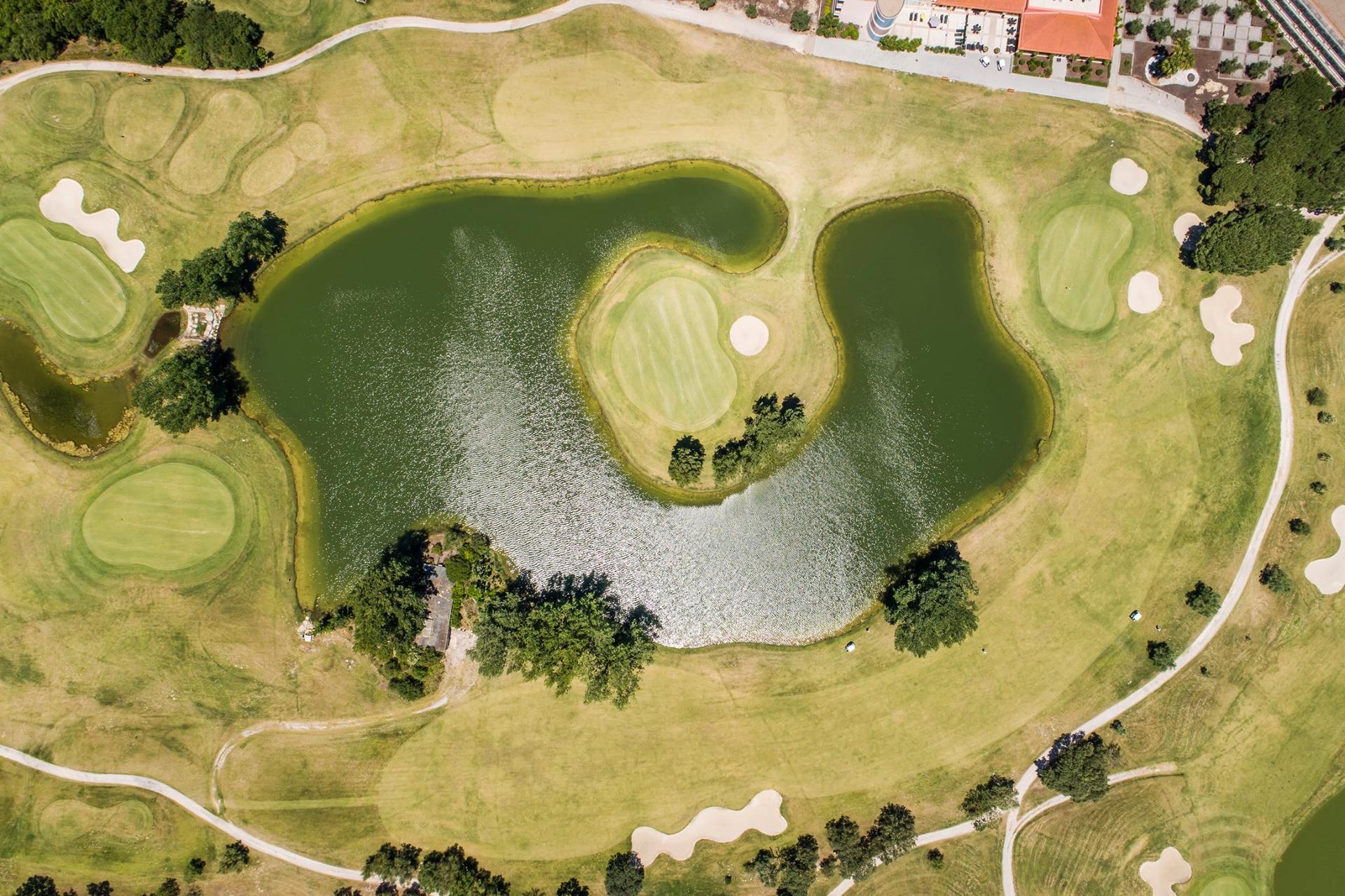 Birdseye view of an island green at Montado Hotel & Golf Resort